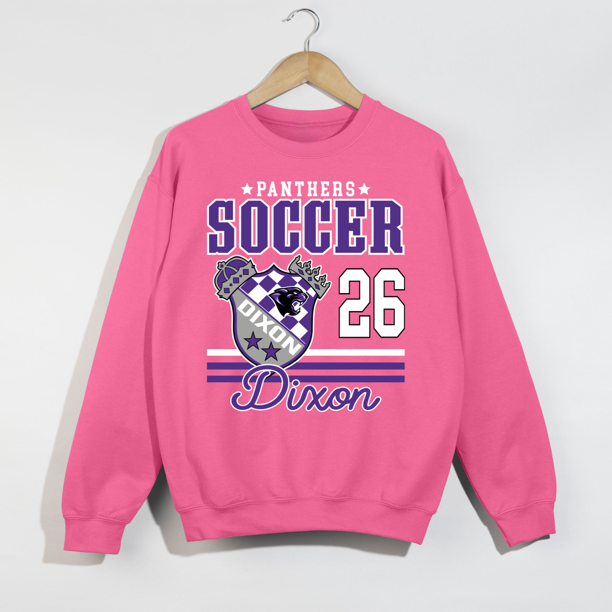 Bright pink Dixon Panthers Soccer 2026 sweatshirt with purple and white varsity soccer graphic, Panthers crest and Dixon script.