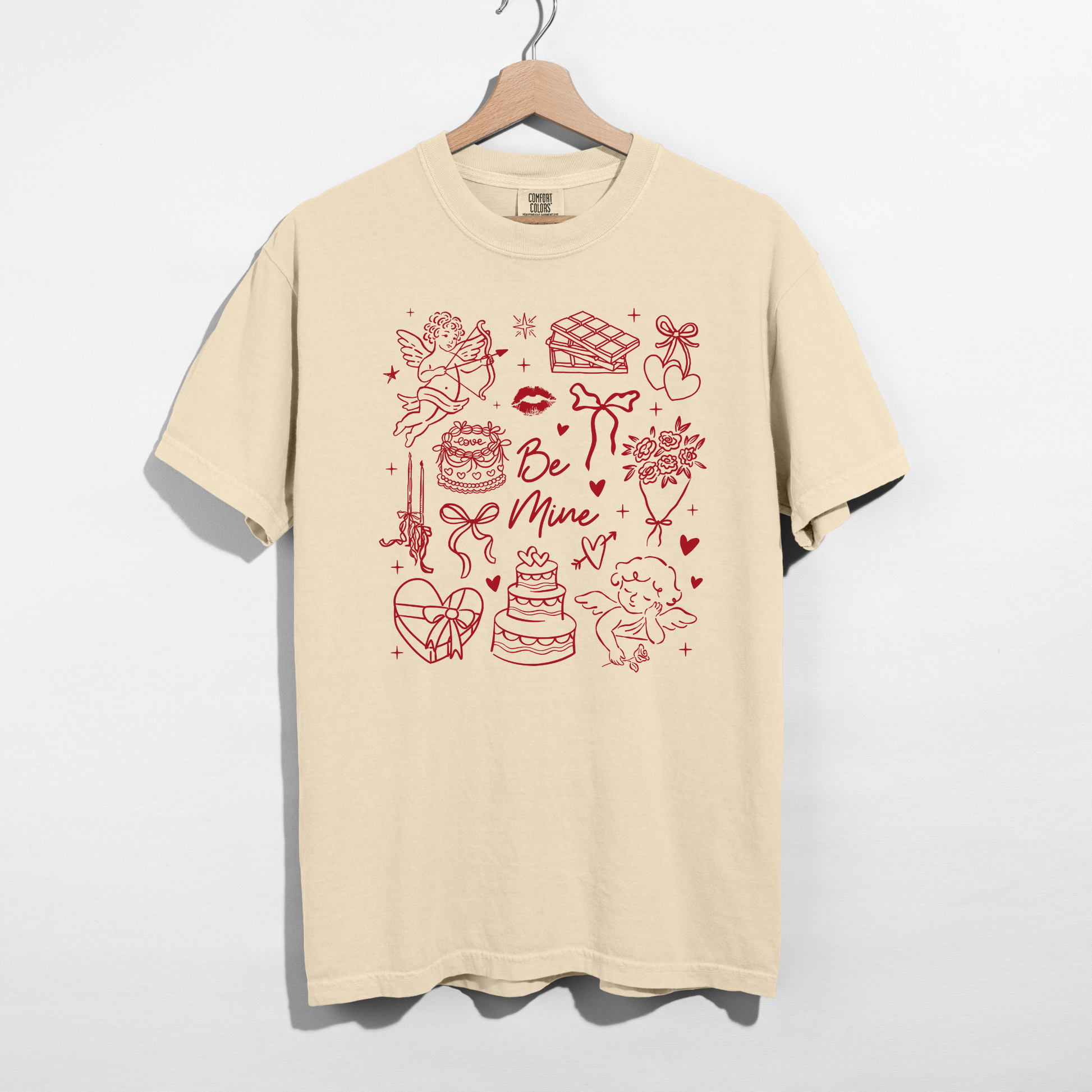 Comfort Colors ivory tee on hanger with red Valentine doodle graphic
