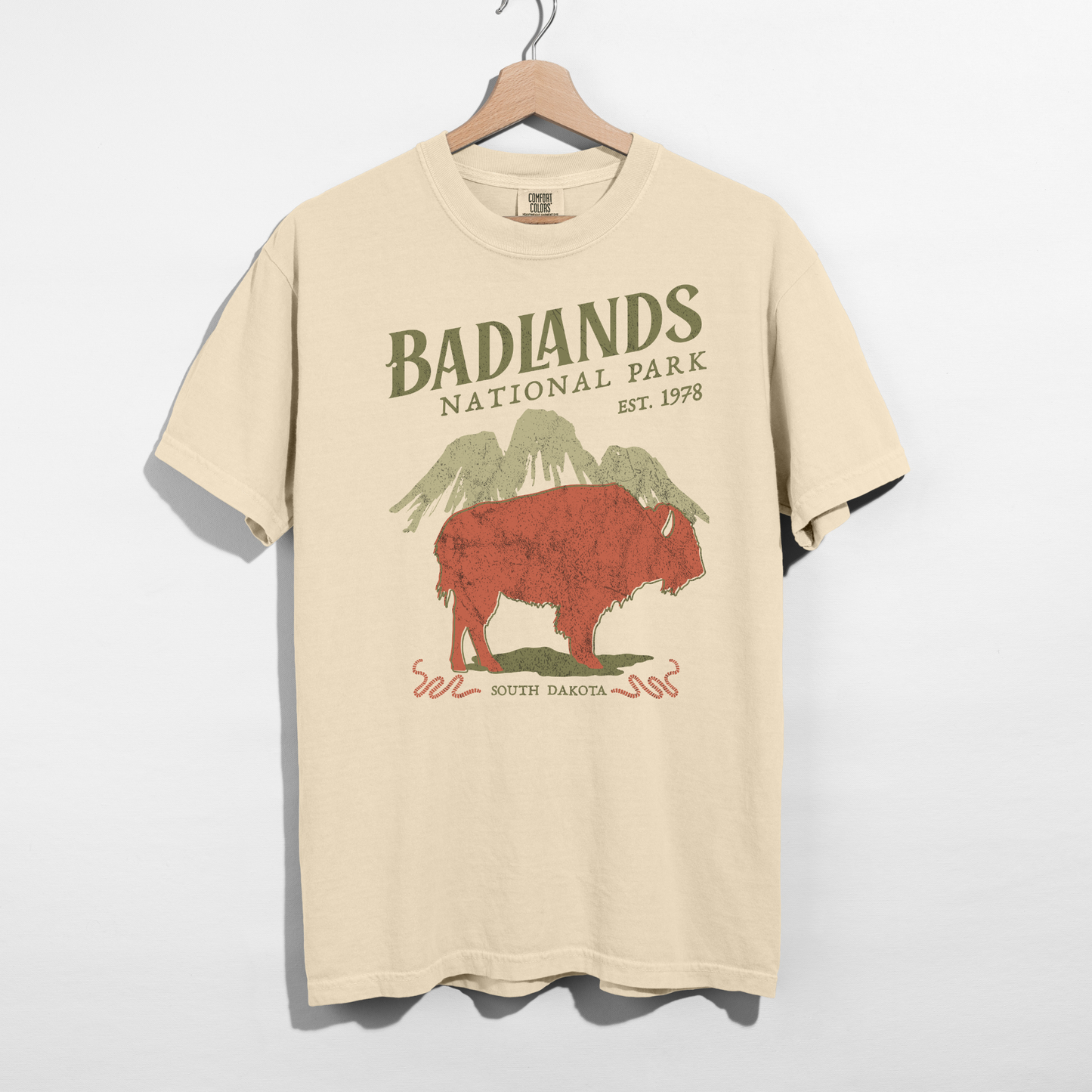Ivory Badlands National Park graphic tee featuring vintage bison and mountain design on Comfort Colors shirt