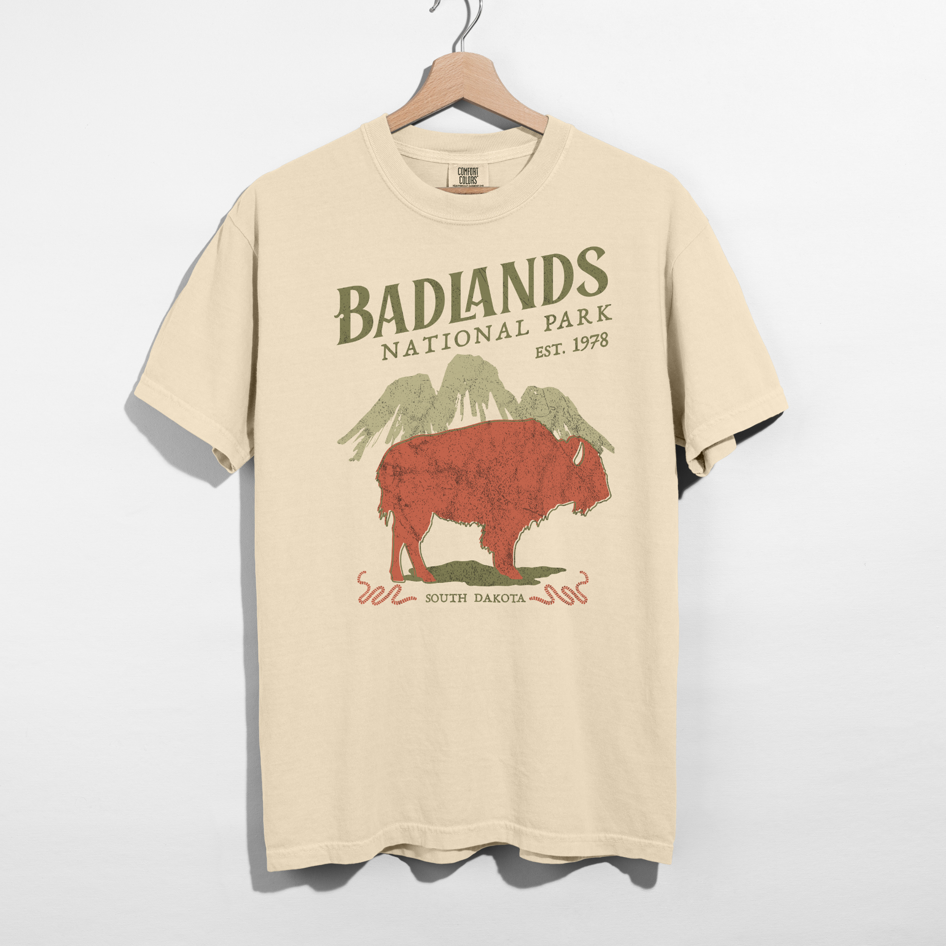 Ivory Badlands National Park graphic tee featuring vintage bison and mountain design on Comfort Colors shirt