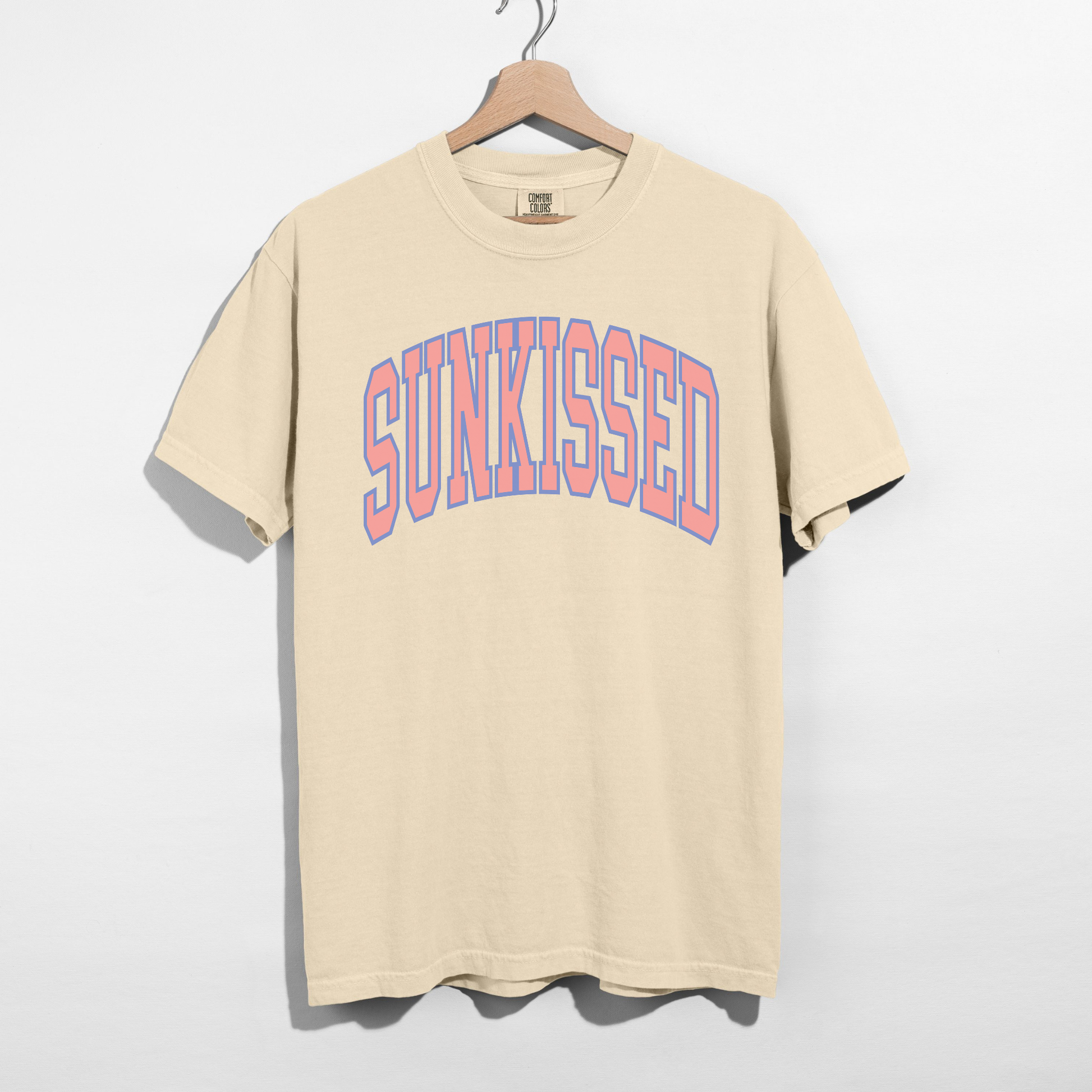 Ivory SUNKISSED graphic tee with pastel arch lettering, soft garment-dyed unisex t-shirt