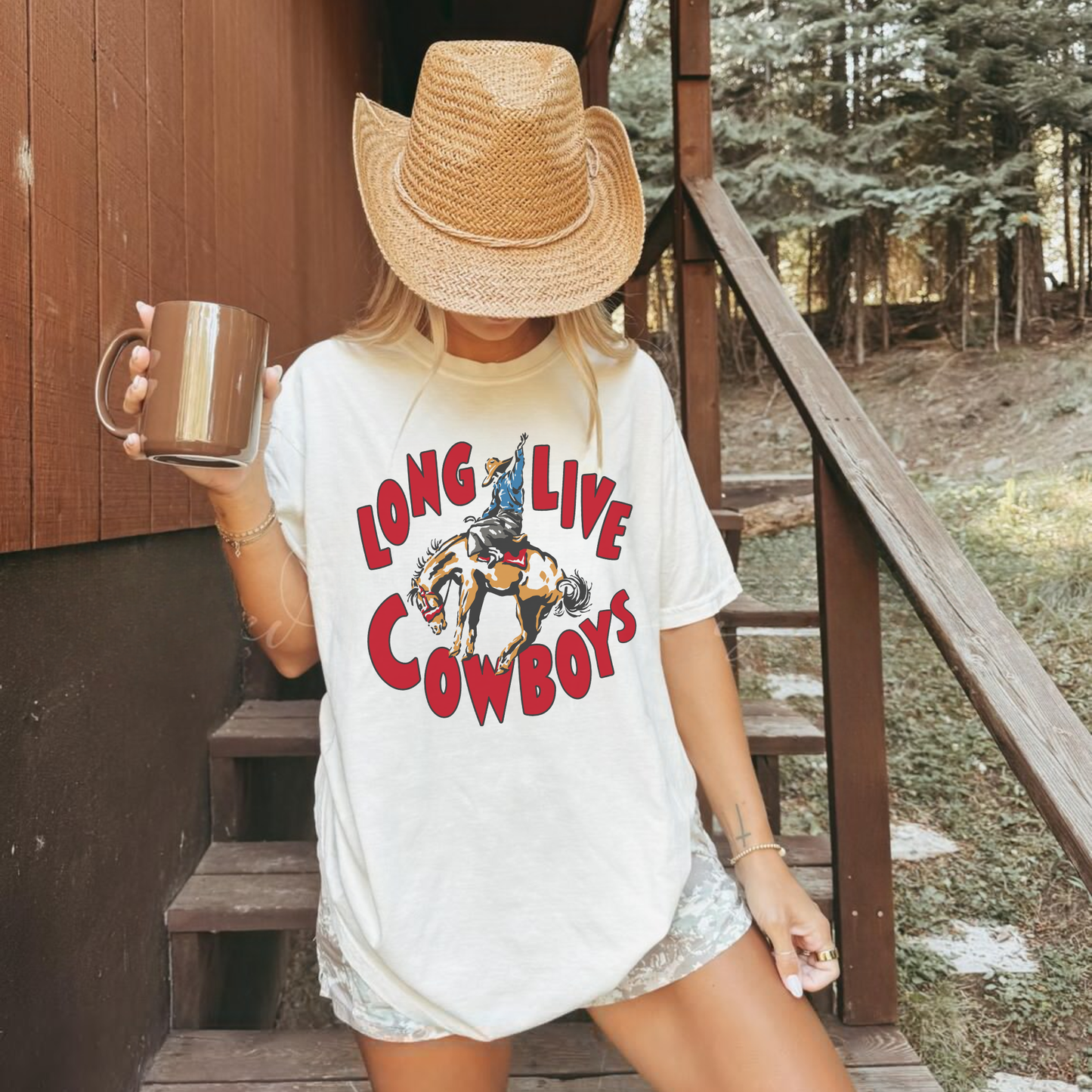 Woman wearing Long Live Cowboys western graphic tee outdoors with straw cowboy hat