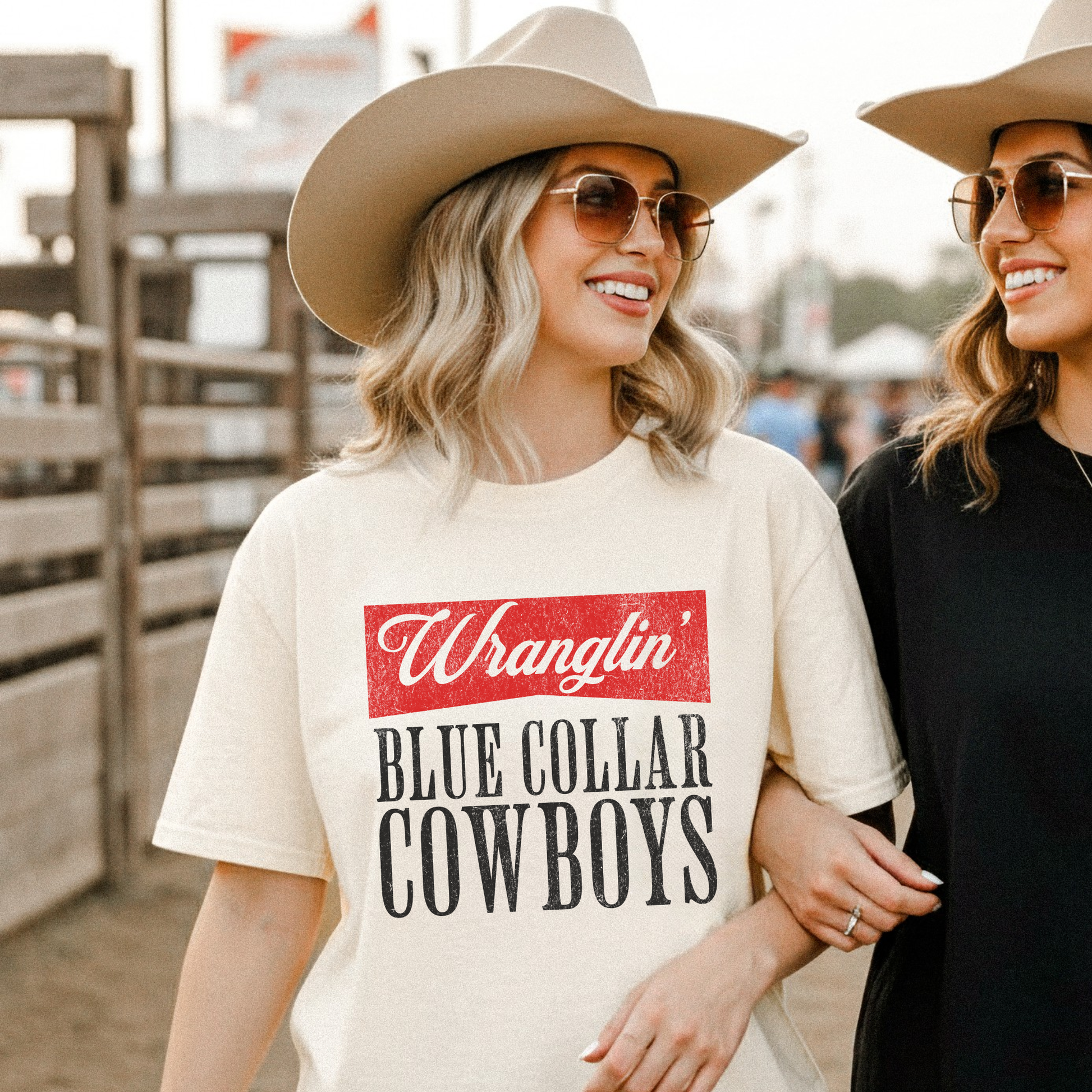 Wranglin’ Blue Collar Cowboys graphic tee worn by woman at rodeo in western outfit