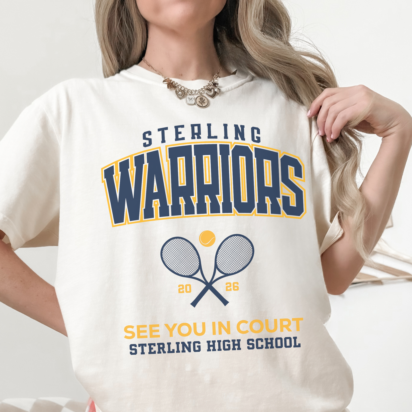 Ivory Sterling Warriors Tennis graphic t-shirt with bold school spirit lettering and tennis artwork
