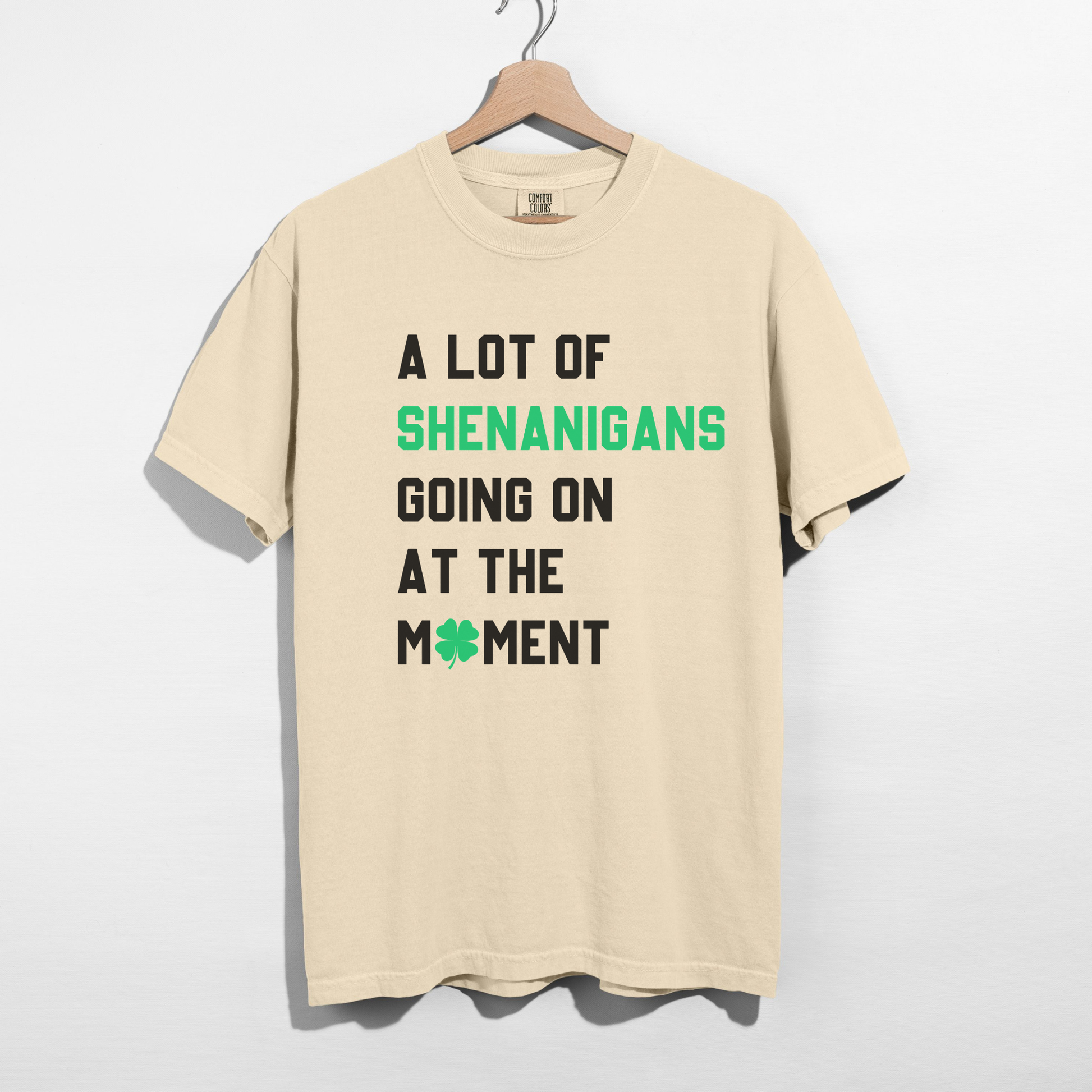 Ivory A Lot of Shenanigans varsity St Patrick’s Day graphic tee with green clover detail