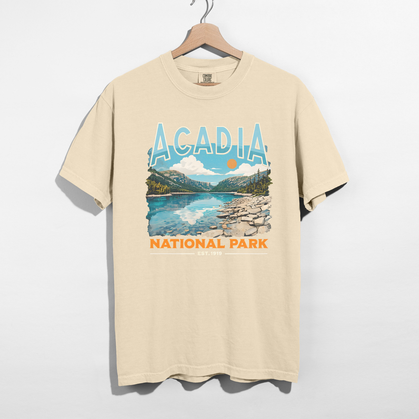 Ivory Acadia National Park national park scenic graphic tee on hanger with retro travel-style mountain design.