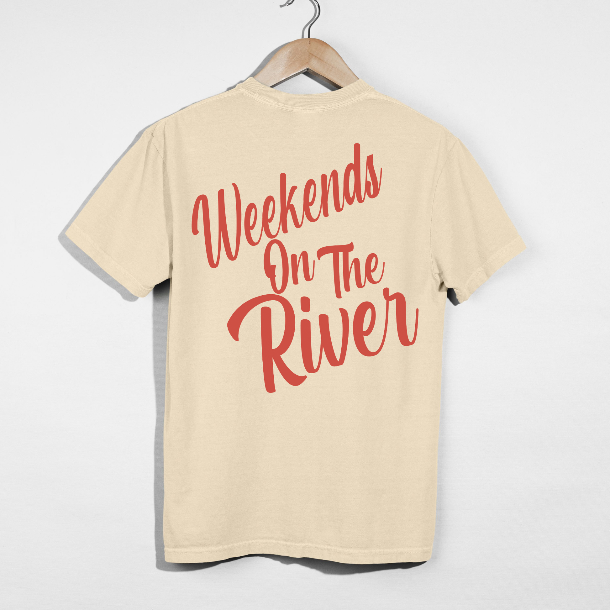Ivory Comfort Colors t-shirt featuring oversized coral “Weekends On The River” lake life graphic on the back.