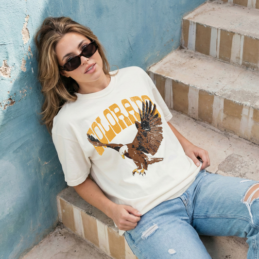 woman wearing colorado eagle graphic tee vintage western shirt casual outfit denim jeans