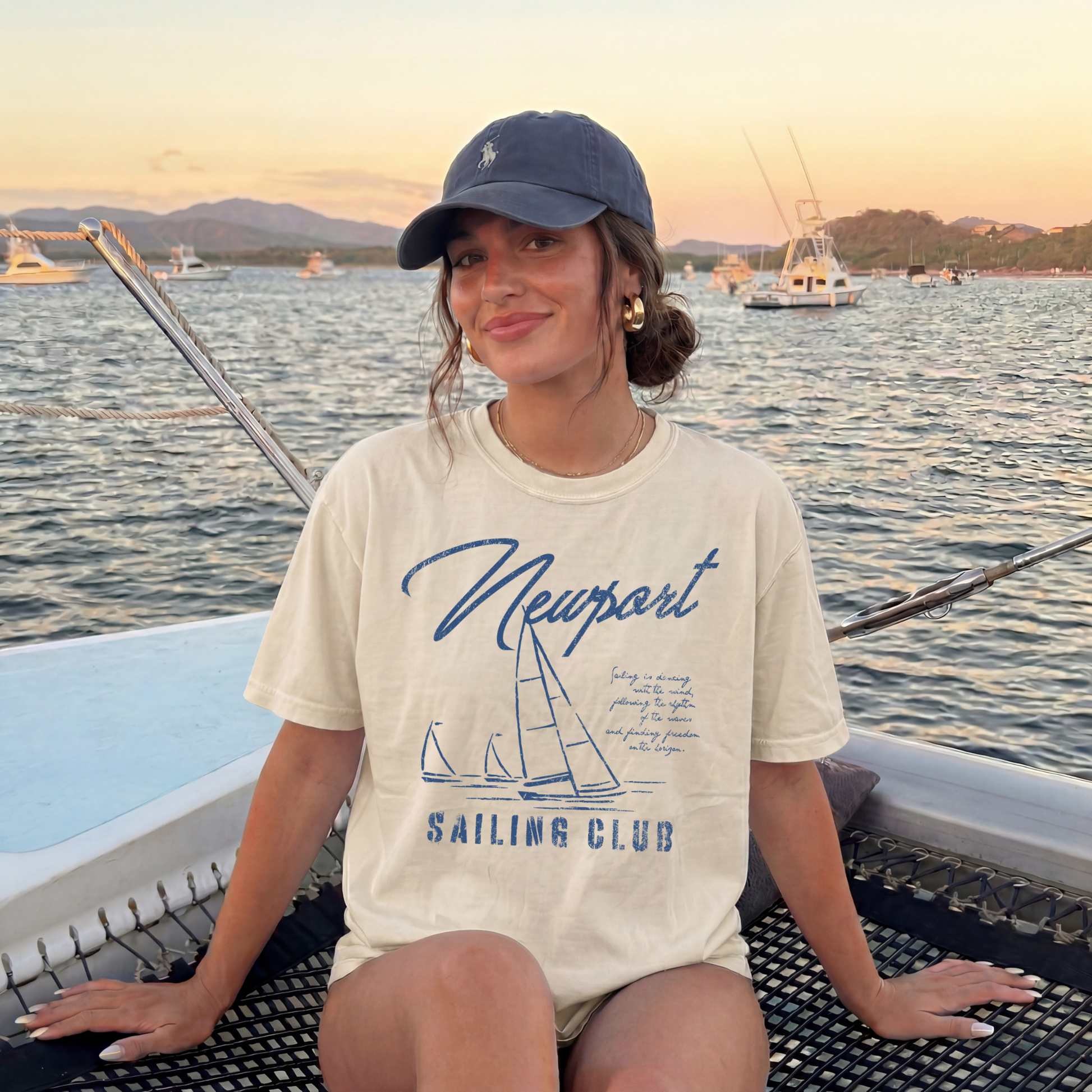 woman wearing ivory nautical sailing club graphic tee casual beach outfit summer style