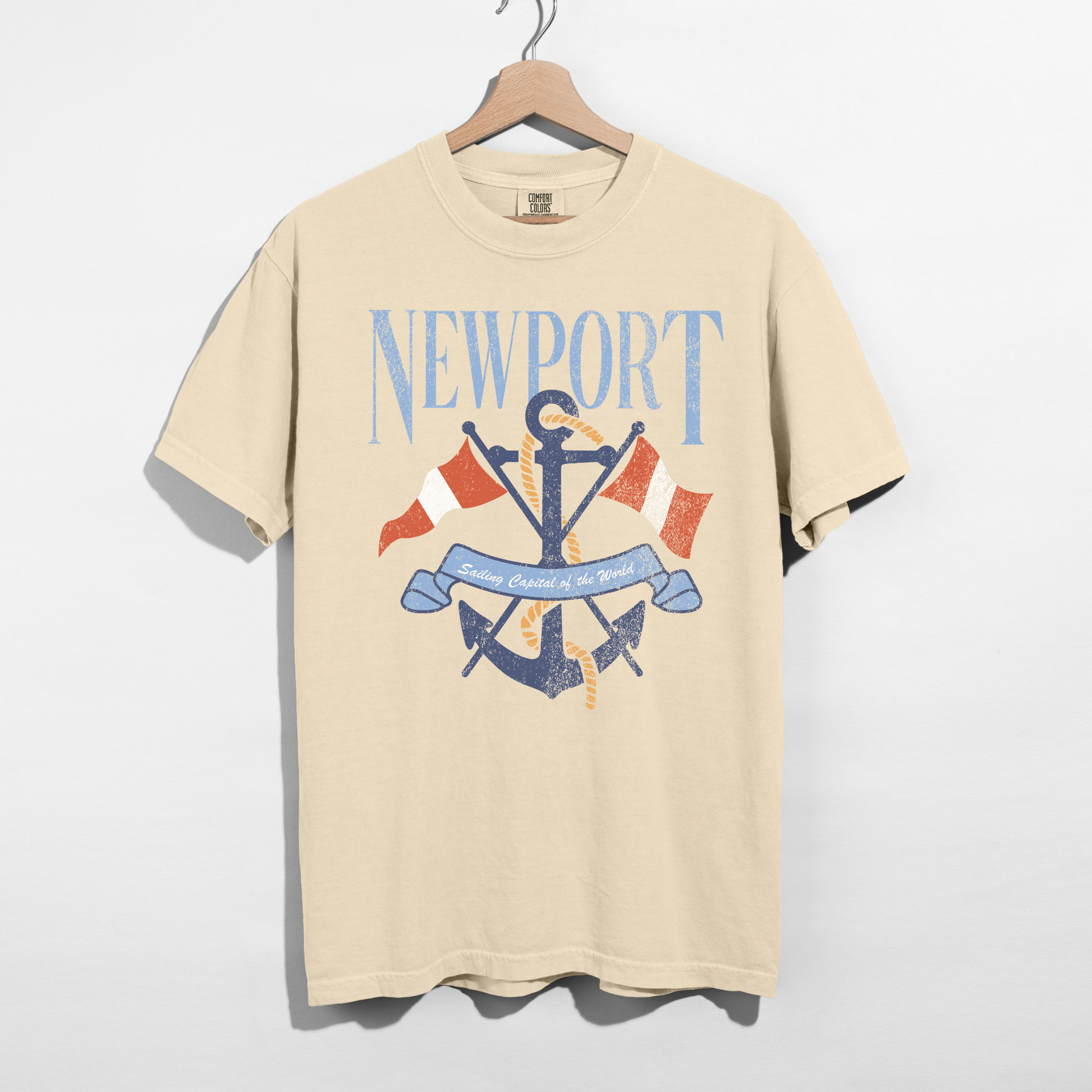 Ivory Comfort Colors Newport nautical graphic tee with anchor and flags on hanger