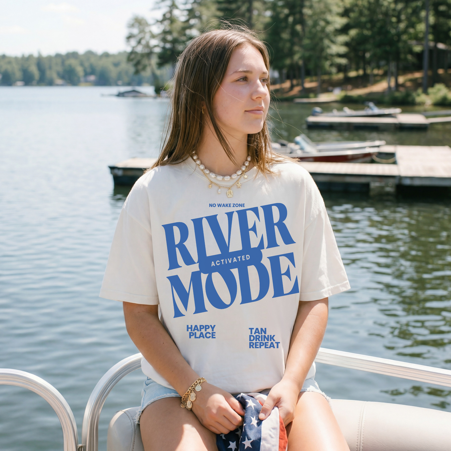 ivory river mode graphic tee worn on boat lake outfit summer