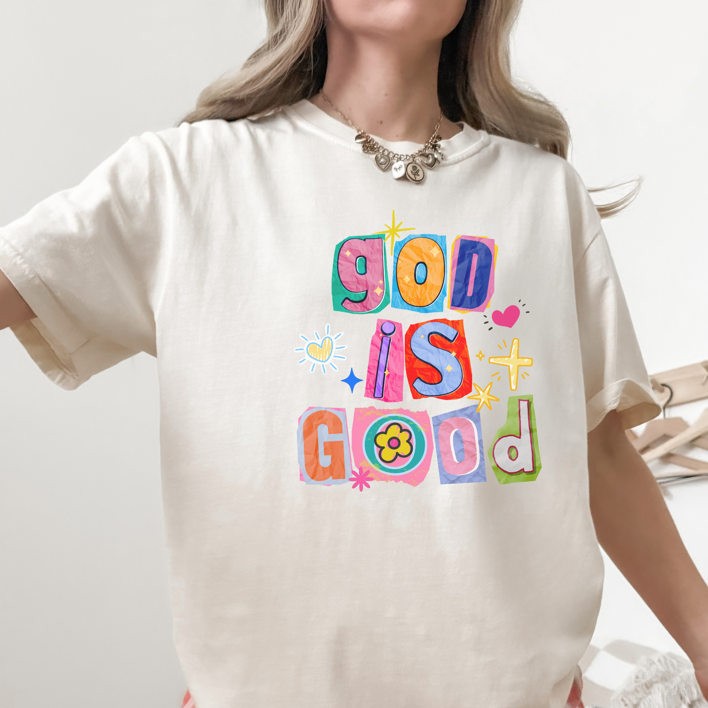 Close-up of ivory God Is Good colorful Christian graphic tee
