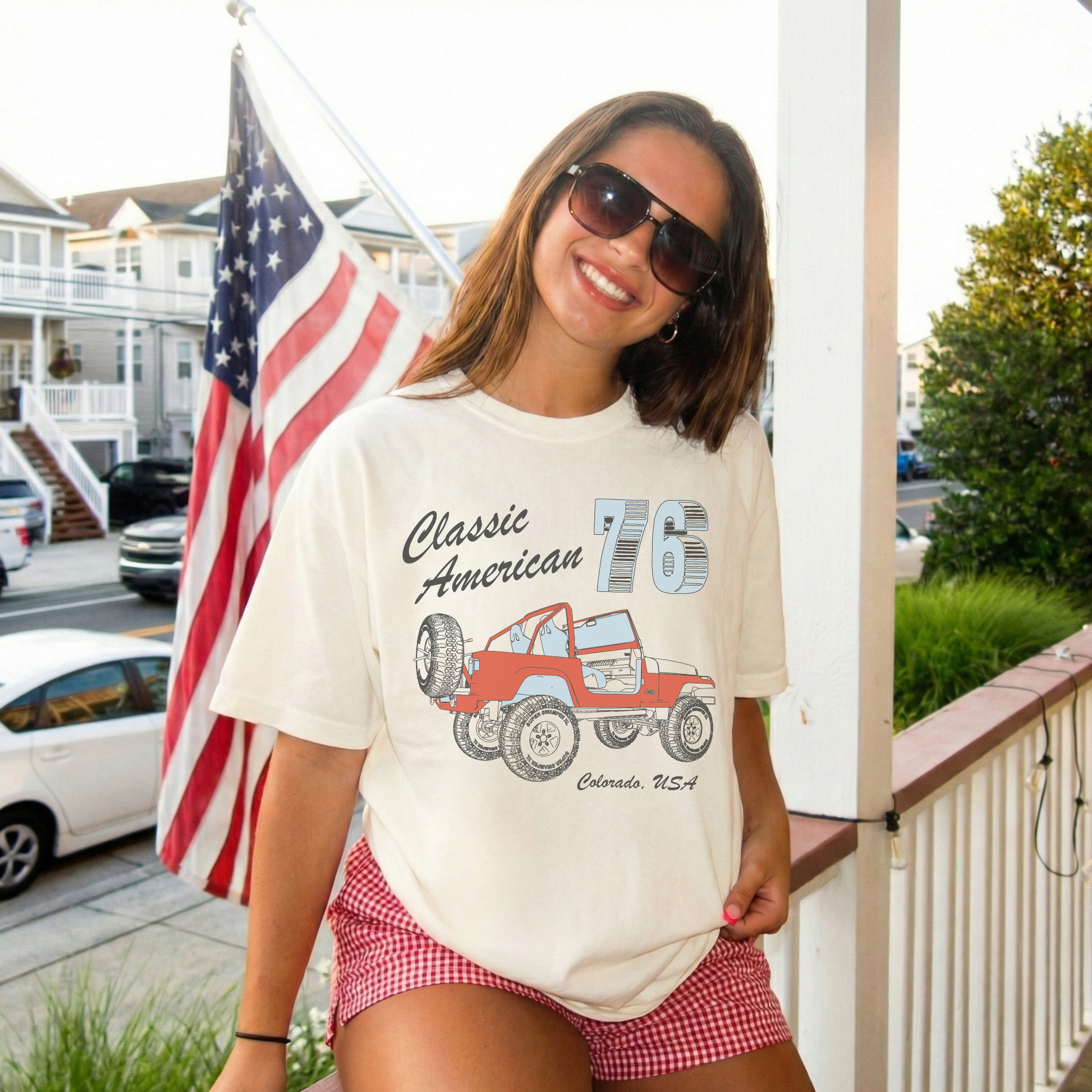 woman wearing ivory vintage jeep graphic t shirt with american flag background patriotic summer outfit
