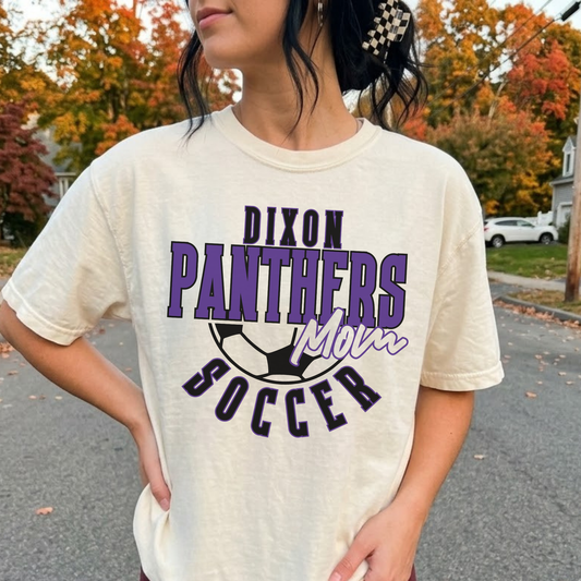 Woman wearing ivory Dixon Panthers Soccer Mom graphic tee with purple varsity Panthers design
