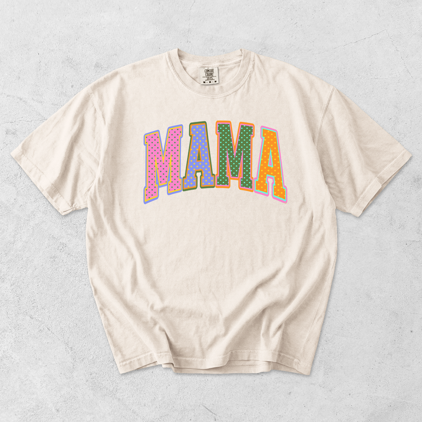Ivory Comfort Colors mama graphic t-shirt flat lay with colorful retro polka dot mama lettering