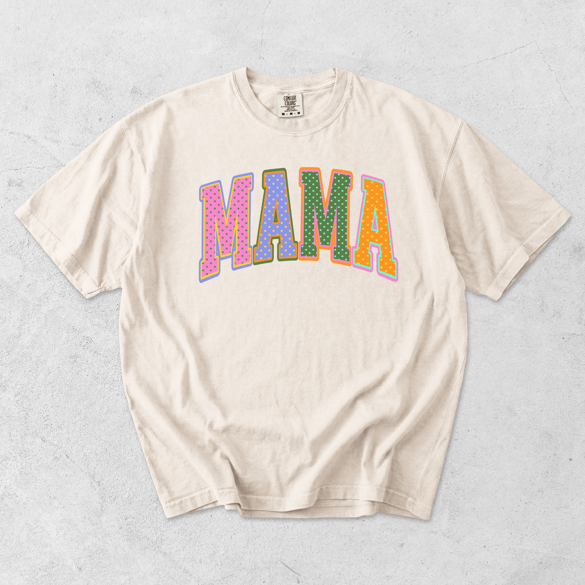 Ivory Comfort Colors mama graphic t-shirt flat lay with colorful retro polka dot mama lettering