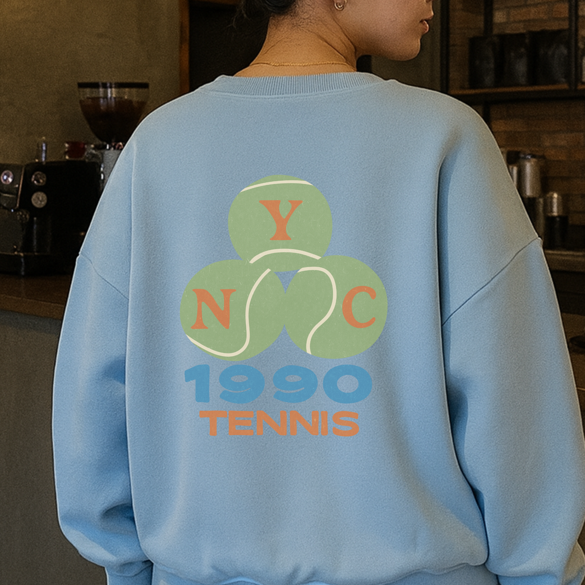 Light blue NYC tennis sweatshirt showing full back vintage tennis graphic