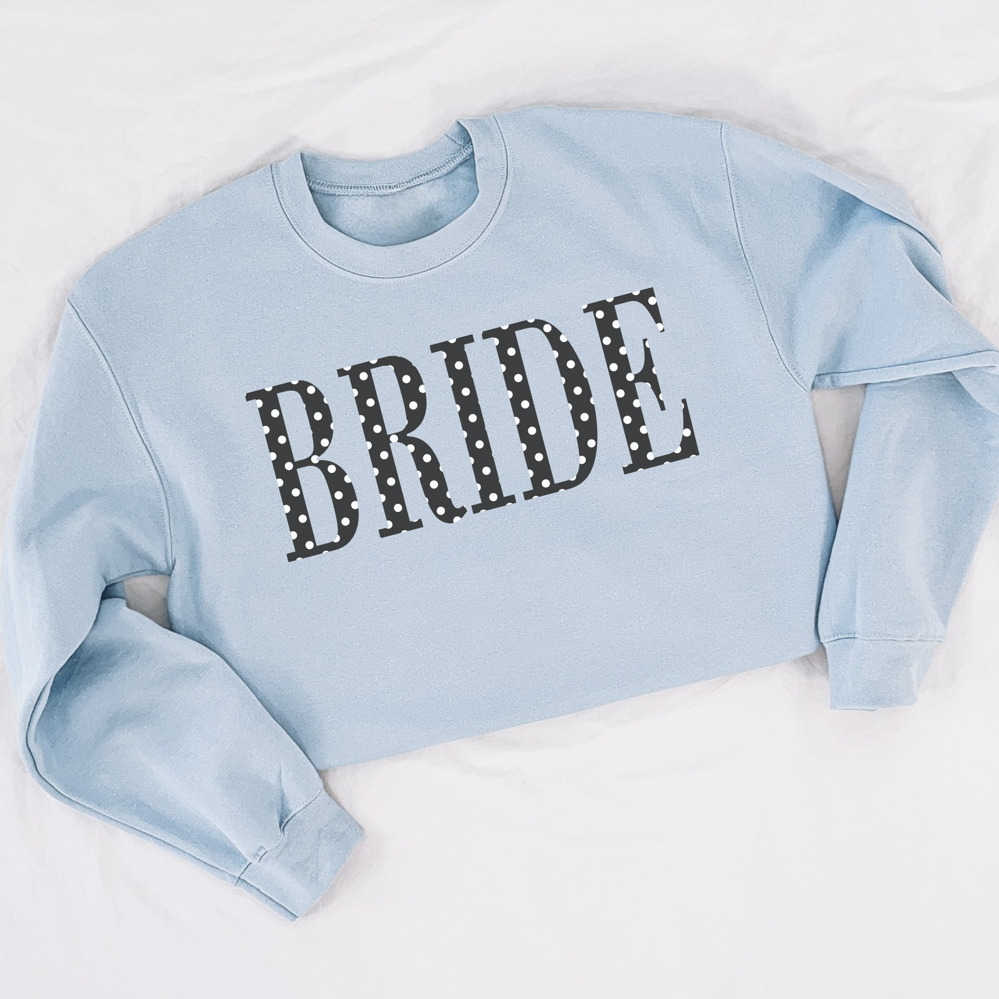 Light blue BRIDE polka dot crewneck sweatshirt styled flat lay