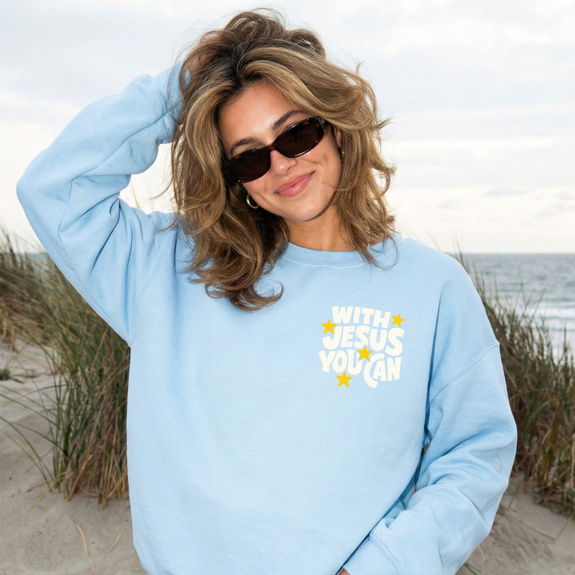 light blue christian sweatshirt with small front pocket design with Jesus you can faith graphic coastal style crewneck