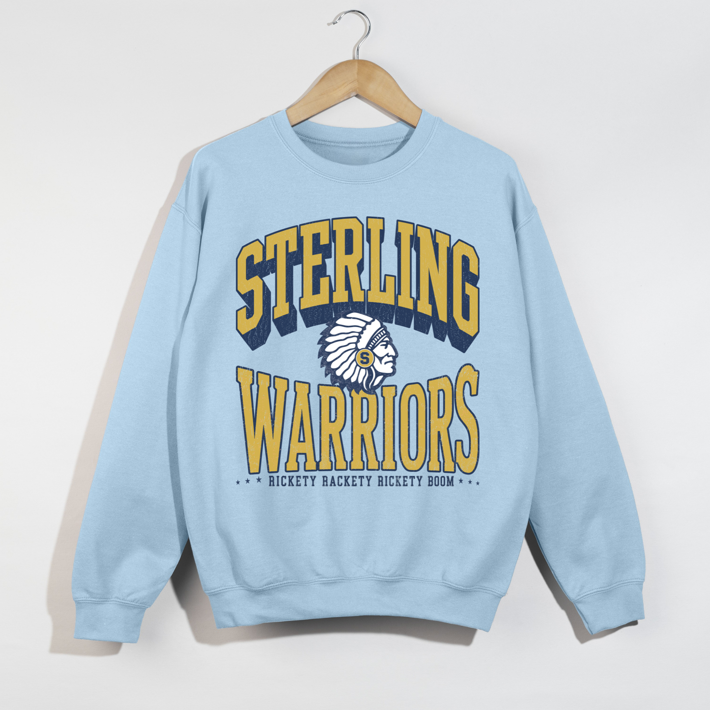 Light blue Sterling Warriors graphic sweatshirt featuring distressed varsity lettering, Warrior mascot, and Rickety Rackety Rickety Boom design.