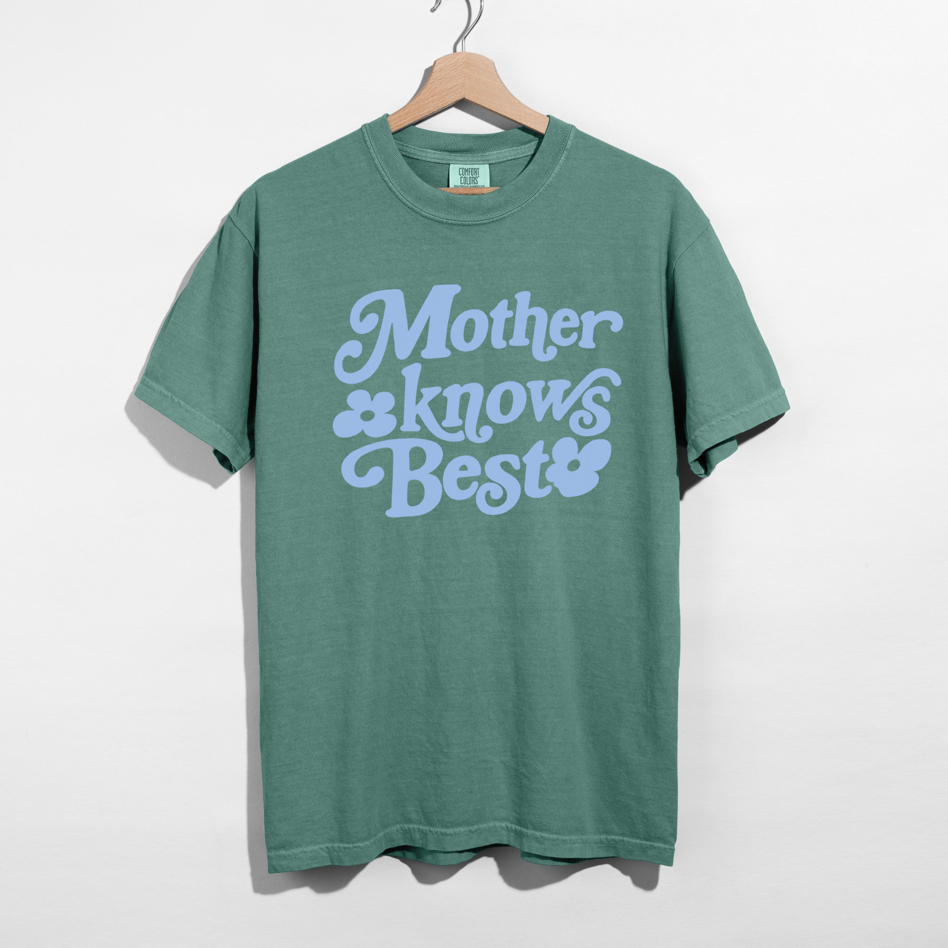 Mother Knows Best retro lettering graphic on green Comfort Colors shirt
