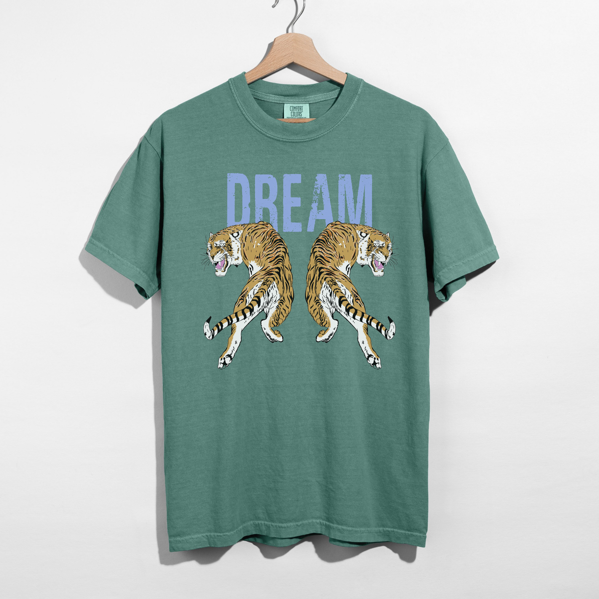 Comfort Colors bay green Dream Tiger graphic tee hanging on hanger with vintage tiger artwork
