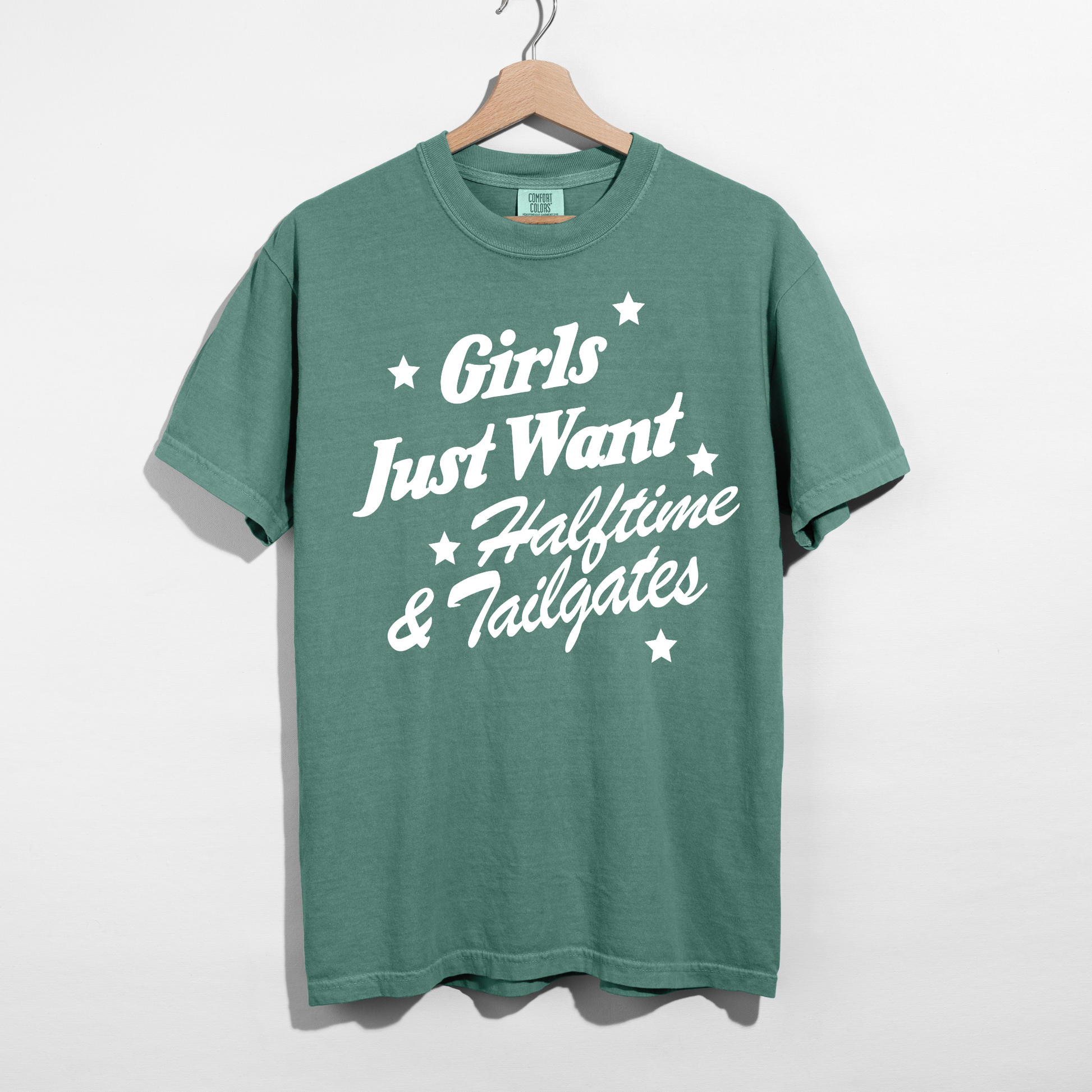 light green football graphic tee with Girls Just Want Halftime & Tailgates design in white.