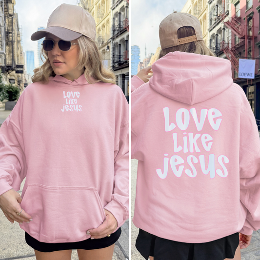 Light pink Christian hoodie showing small front and large back “Love Like Jesus” design.