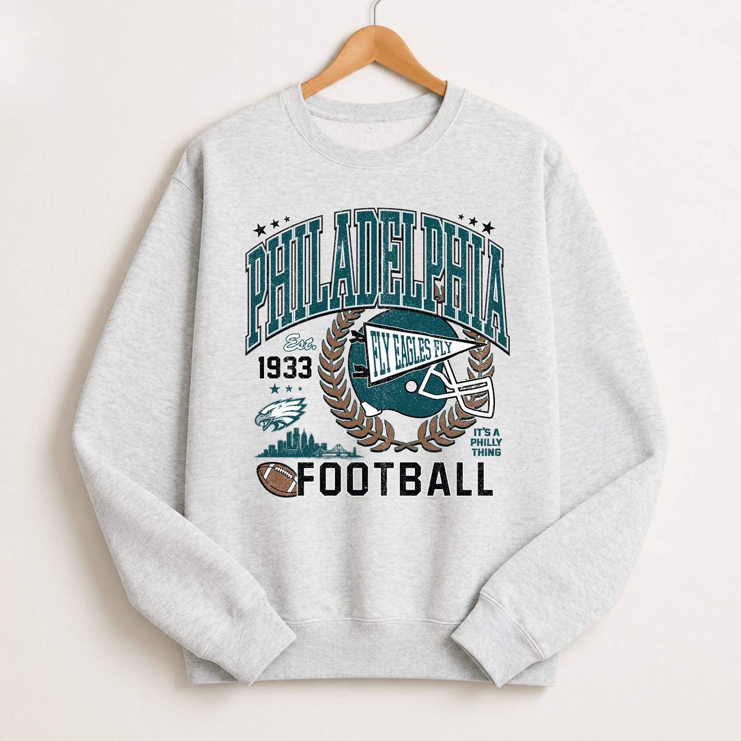 Heather gray Philadelphia football sweatshirt with vintage green helmet, skyline and Fly Eagles Fly graphic
