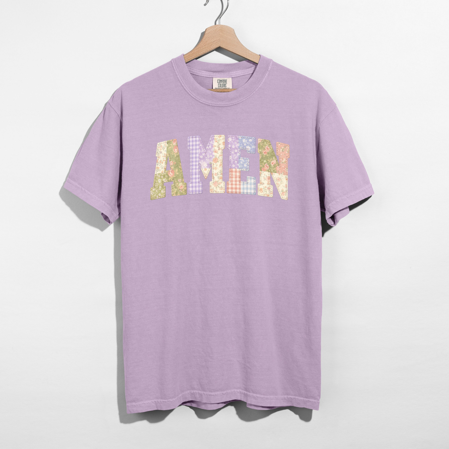Comfort Colors t-shirt featuring printed AMEN faux patchwork letter graphic on hanger