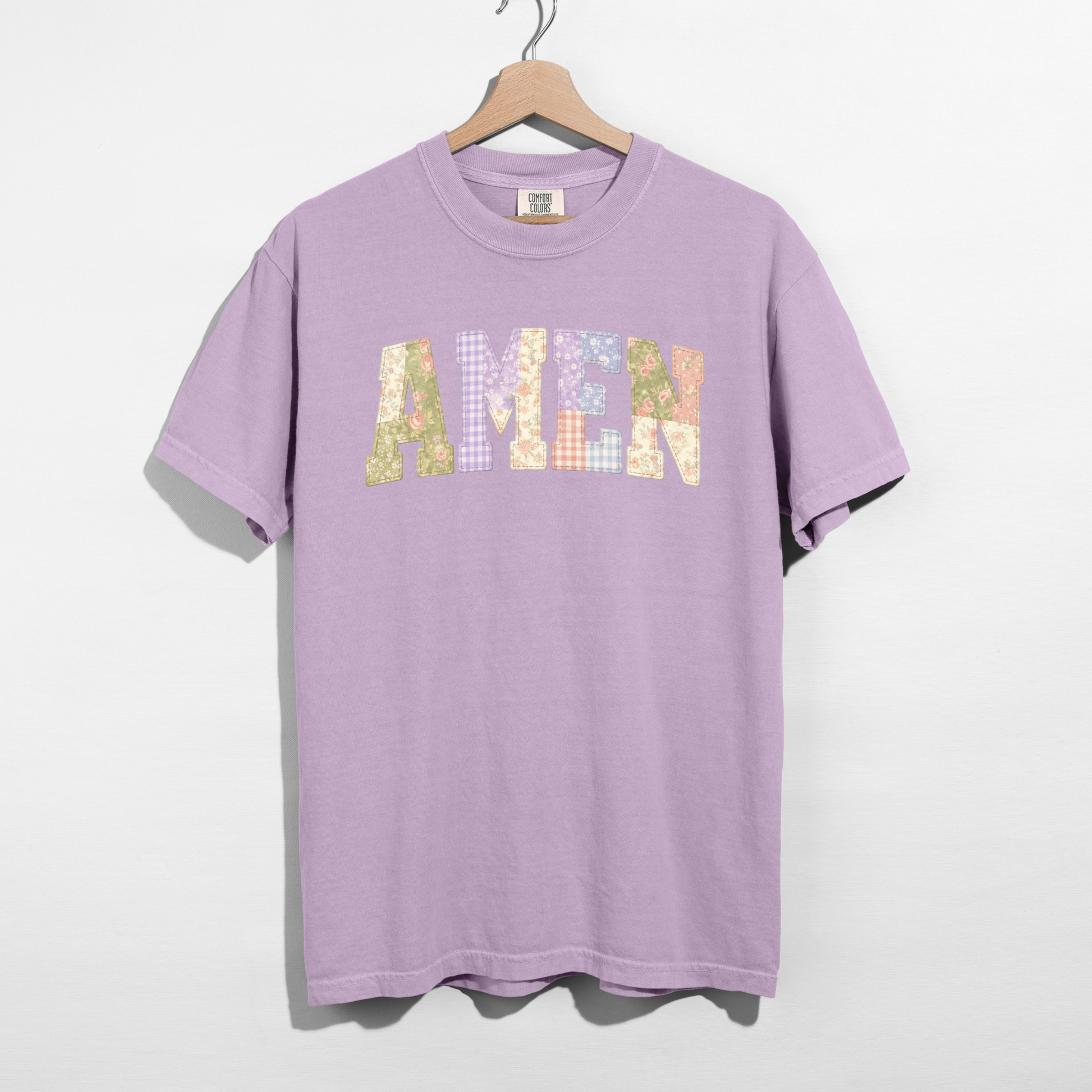Comfort Colors t-shirt featuring printed AMEN faux patchwork letter graphic on hanger