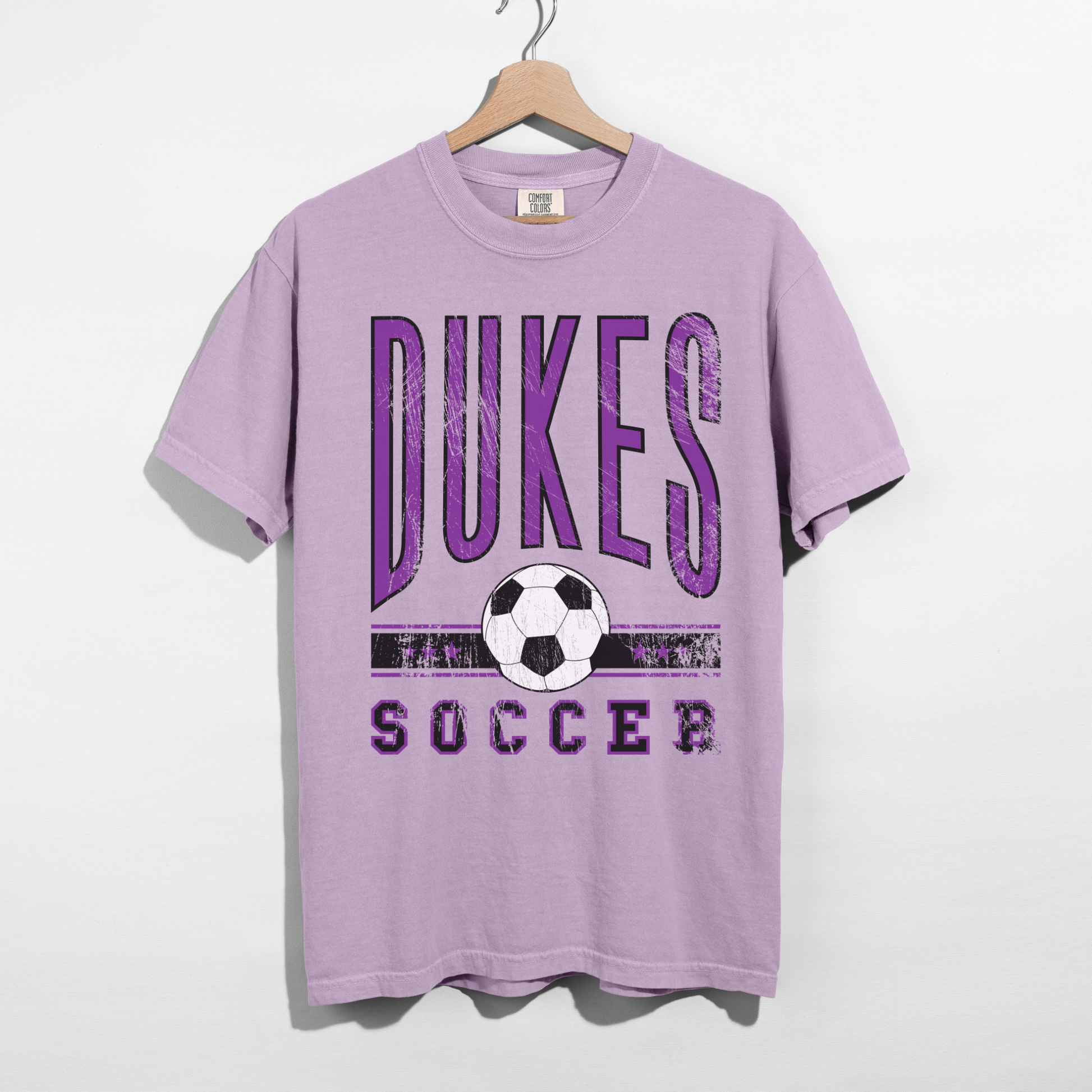dukes soccer purple shirt flat lay comfort colors tee