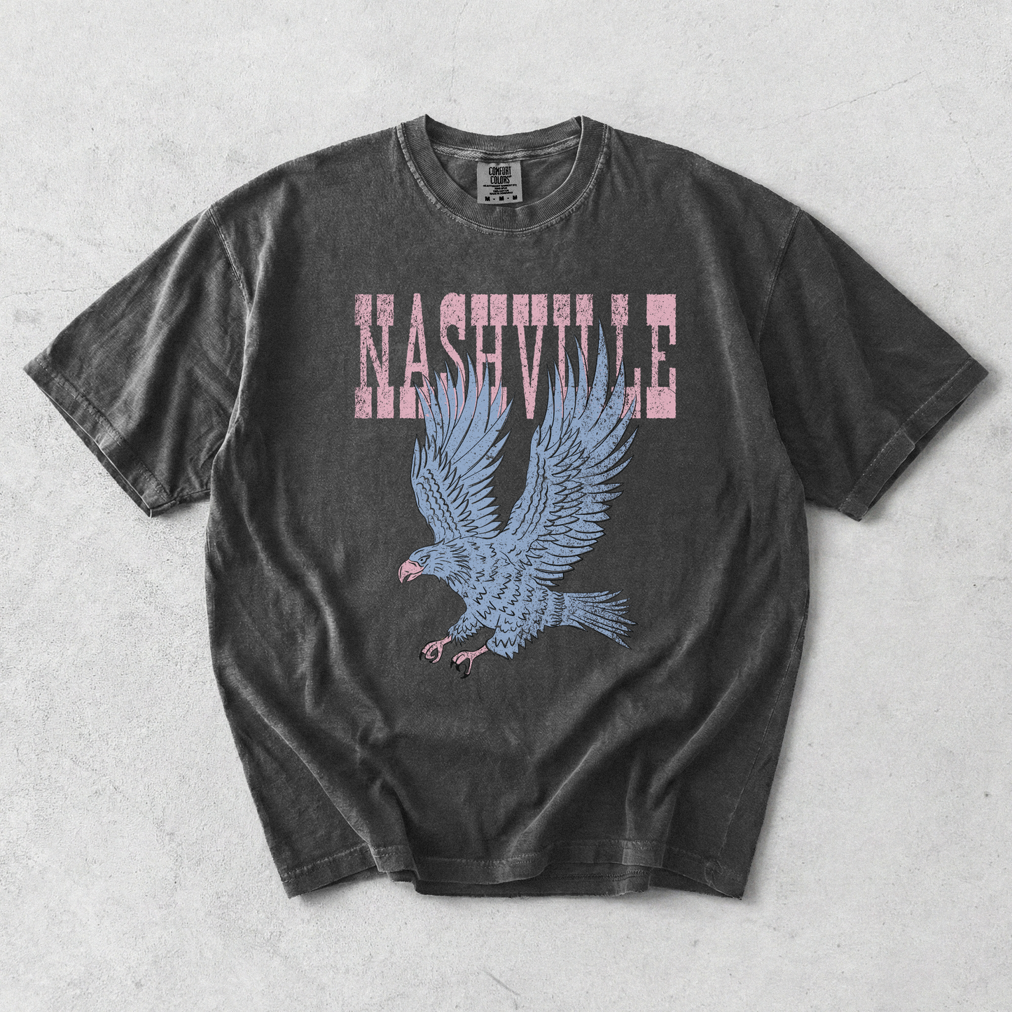 Pepper Comfort Colors Nashville eagle graphic tee with distressed vintage lettering and oversized eagle artwork.