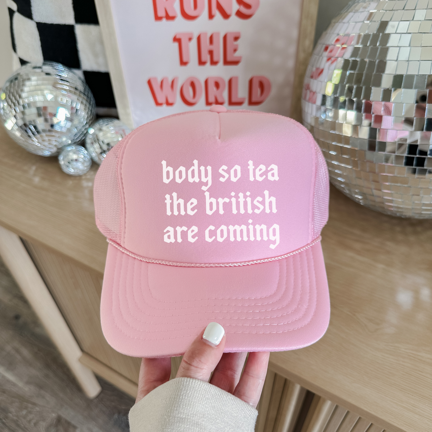 Pink foam trucker hat with bold body so tea slogan on front
