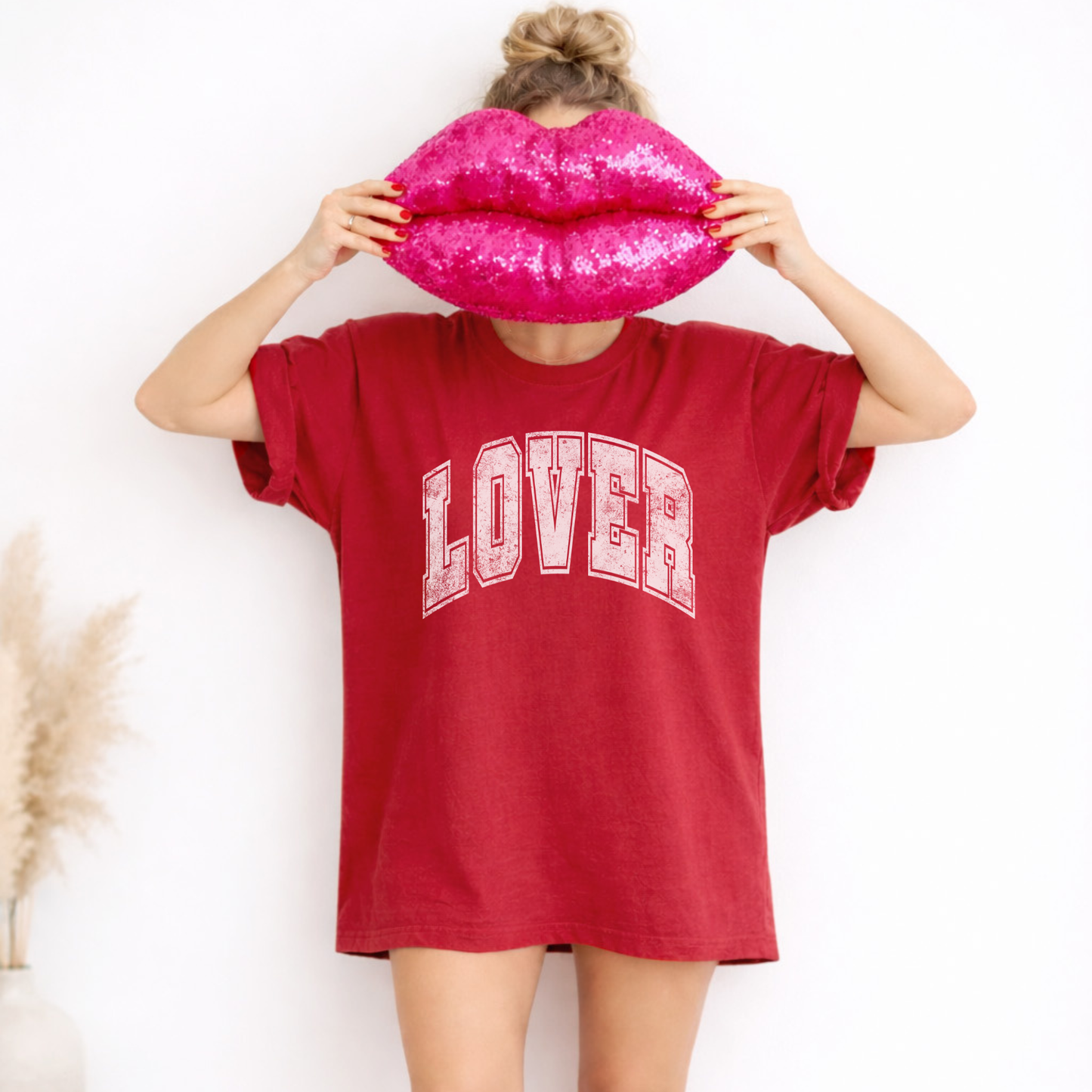 Model wearing red LOVER collegiate graphic tee styled oversized for Valentine’s outfit