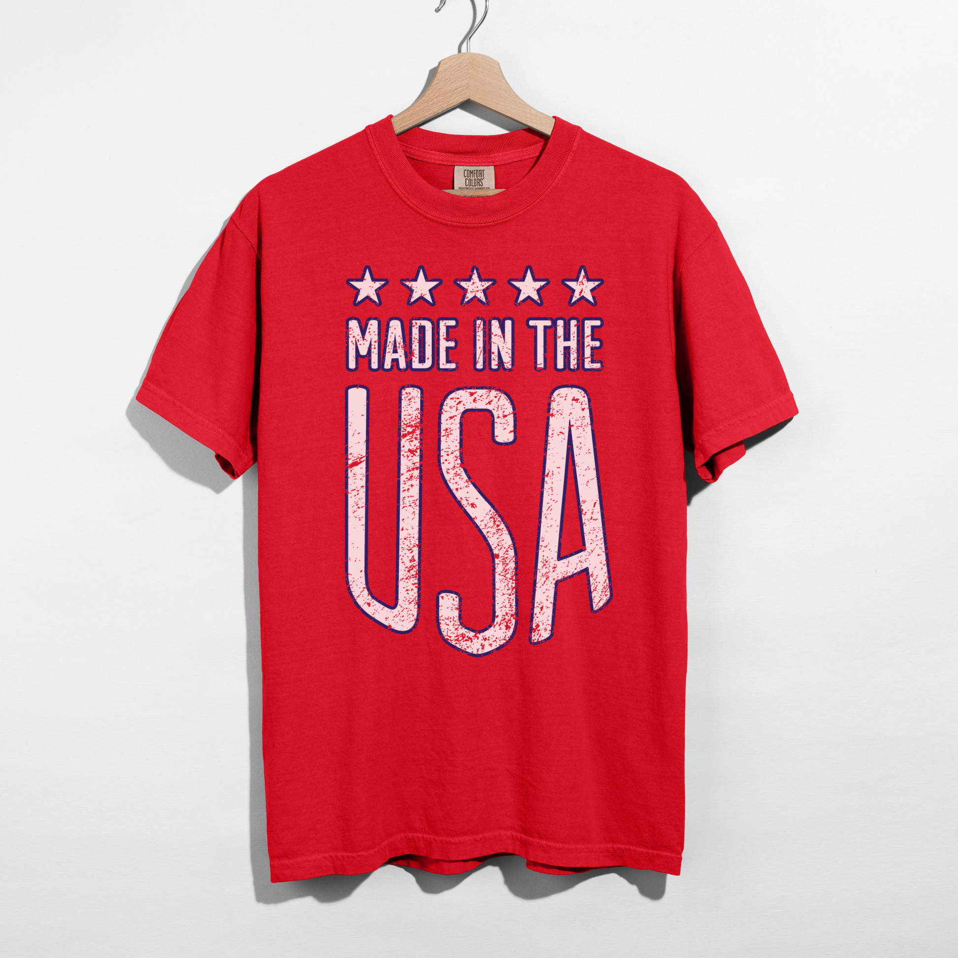 Red Made in the USA graphic t-shirt hanging on hanger vintage distressed USA design Comfort Colors tee
