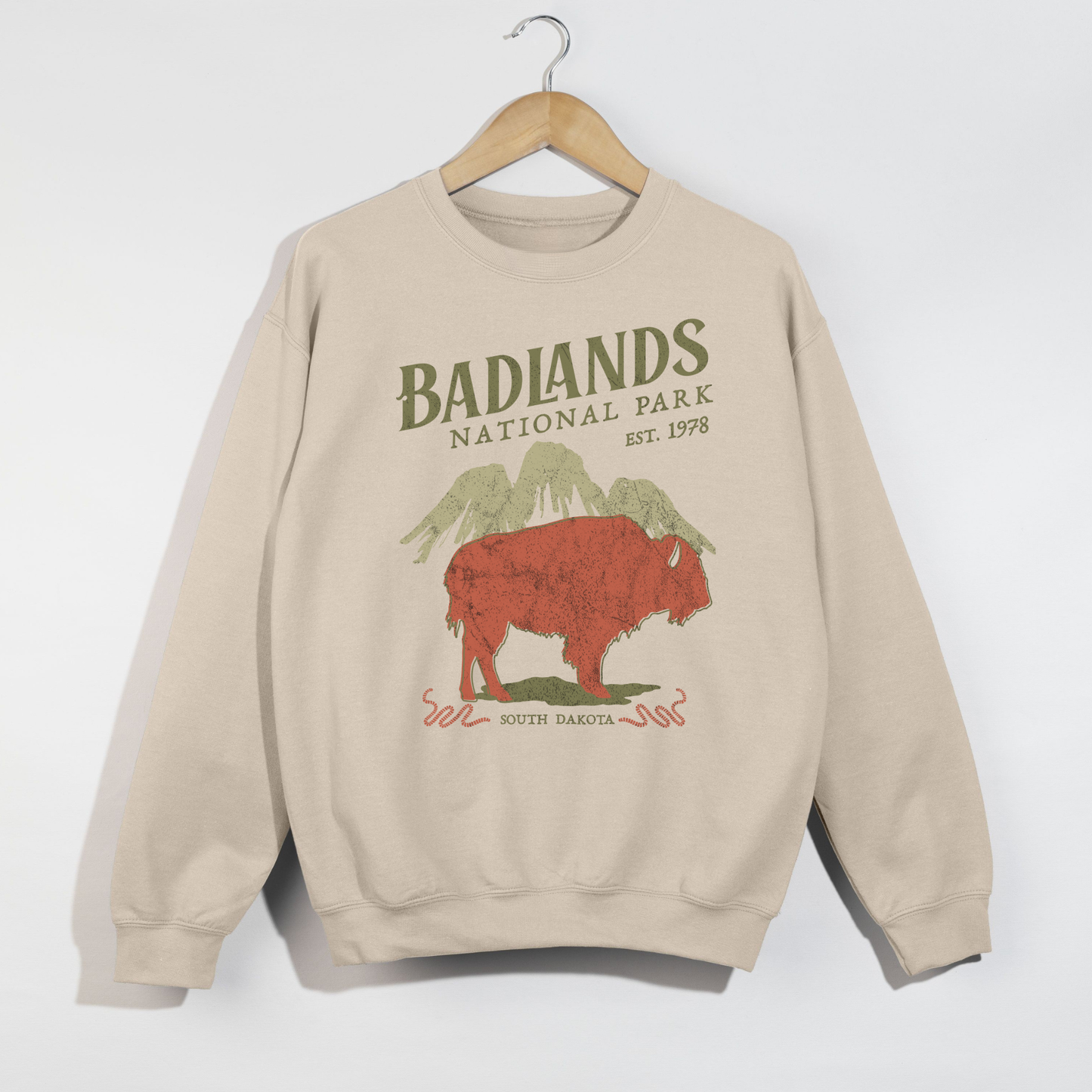 Sand colored Badlands National Park crewneck sweatshirt with vintage outdoor graphic