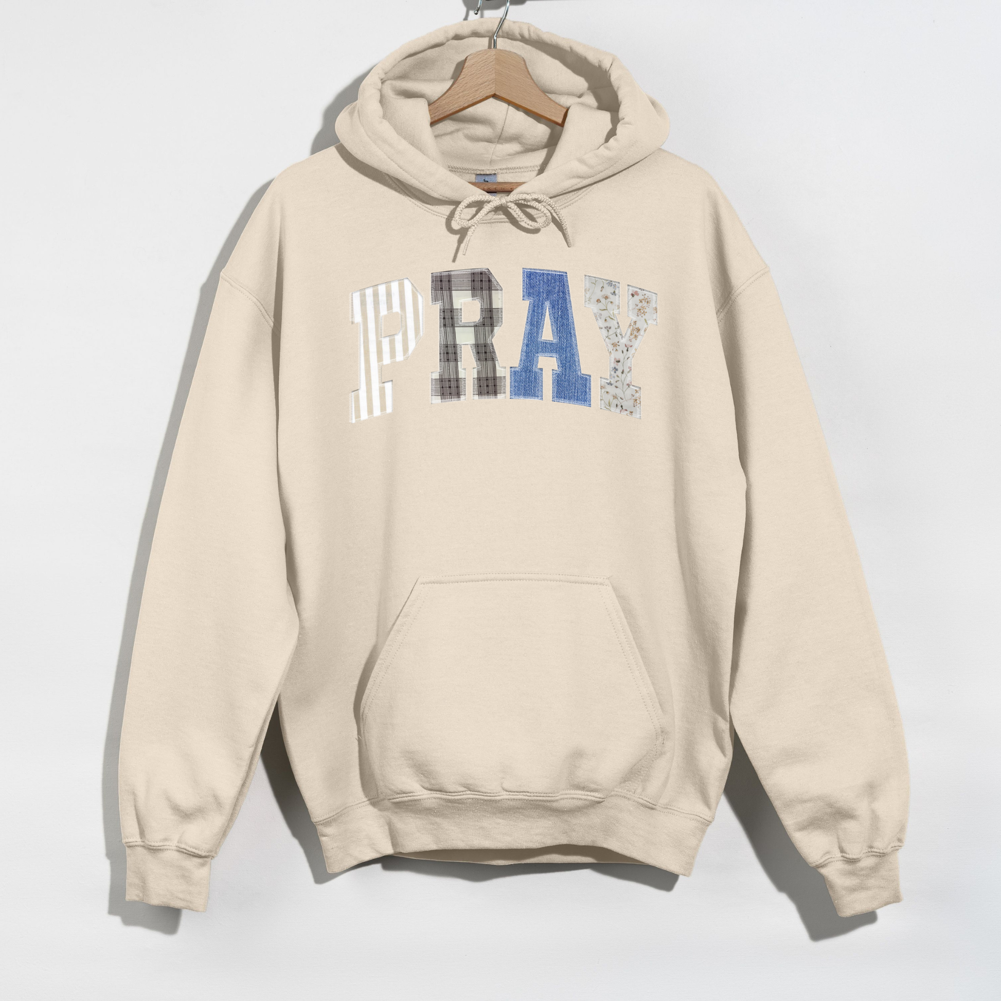 Sand PRAY hoodie flat lay showing unisex fit and hood detail