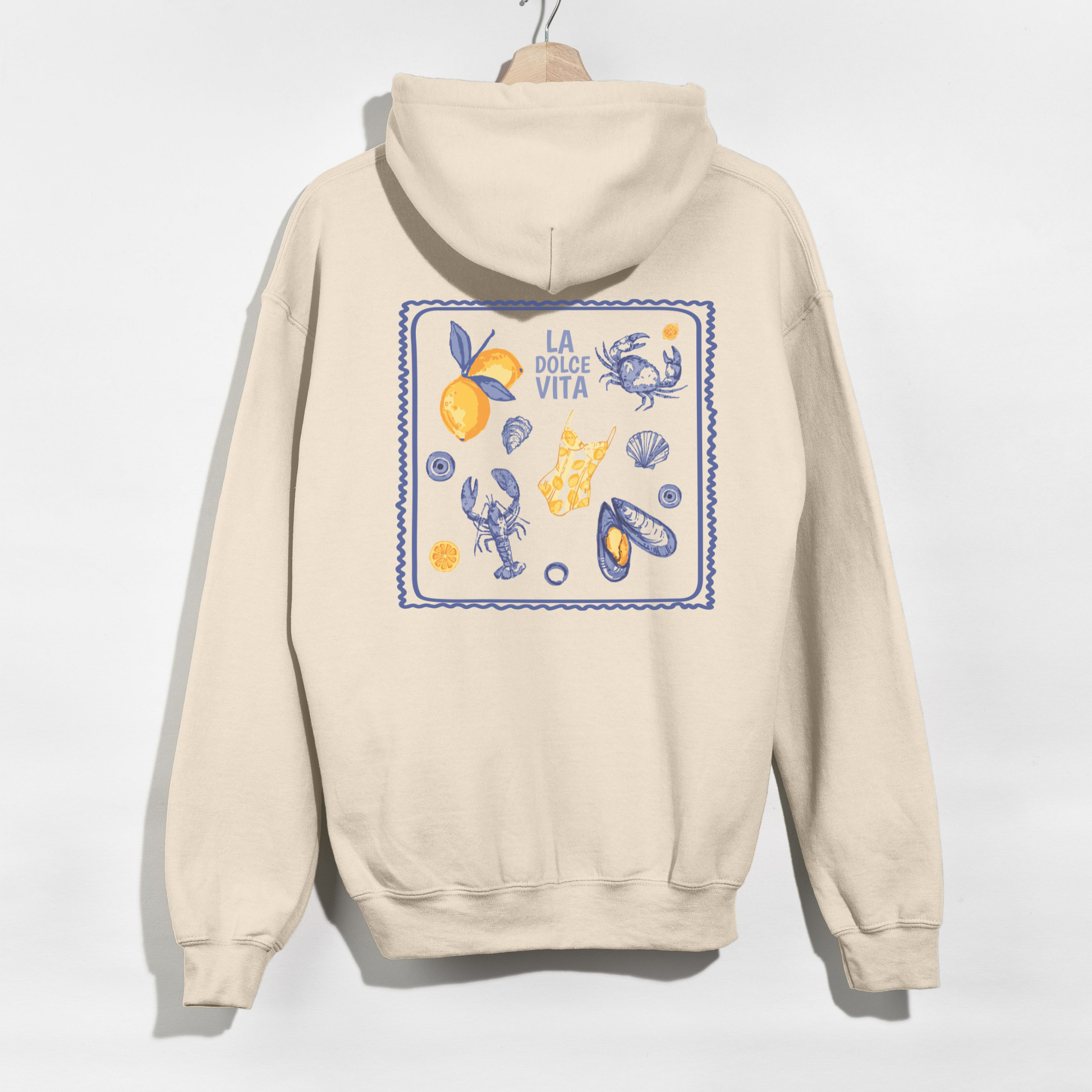 Beige hoodie with a colorful graphic on the back against a white background