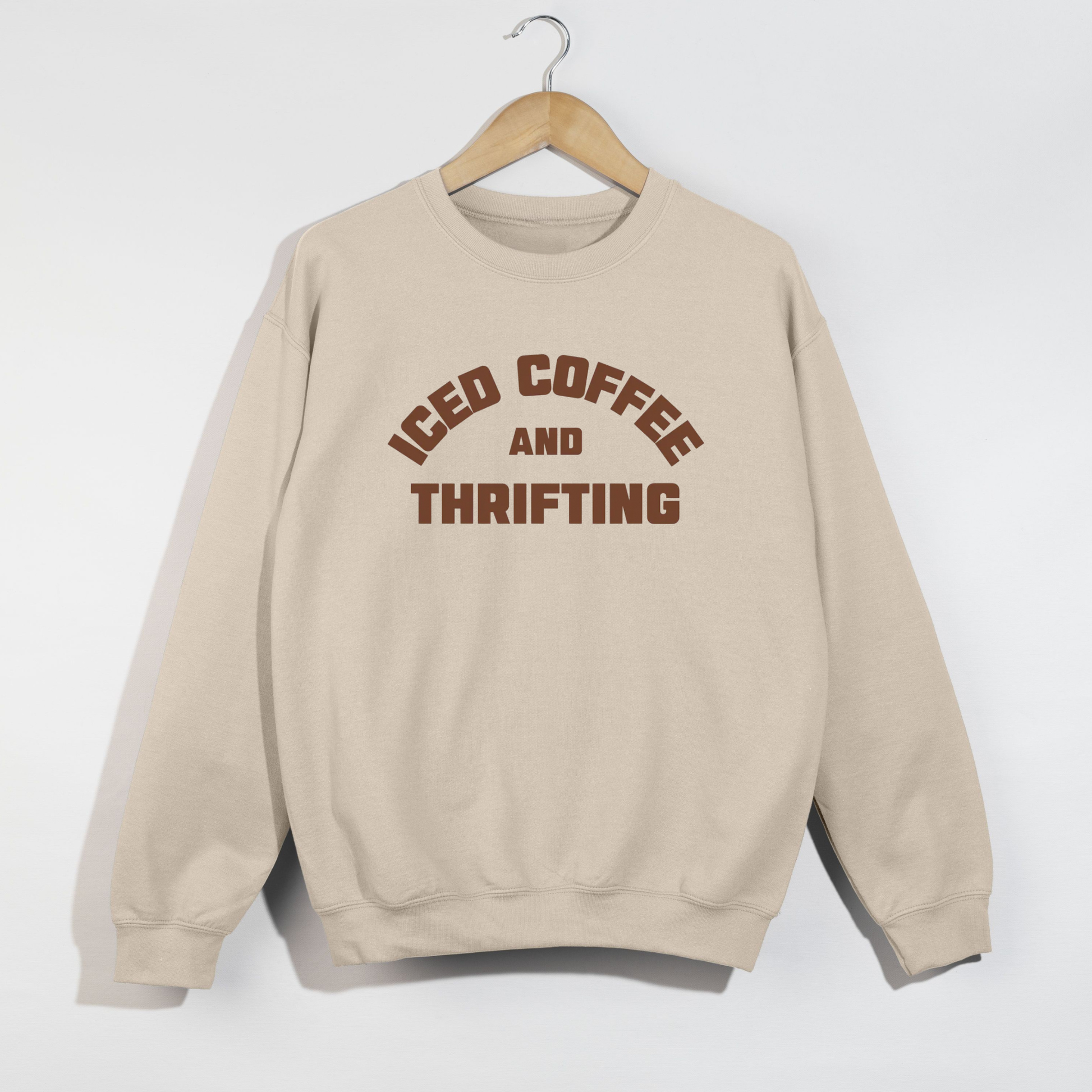 Sand colored iced coffee and thrifting crewneck sweatshirt with cozy neutral aesthetic