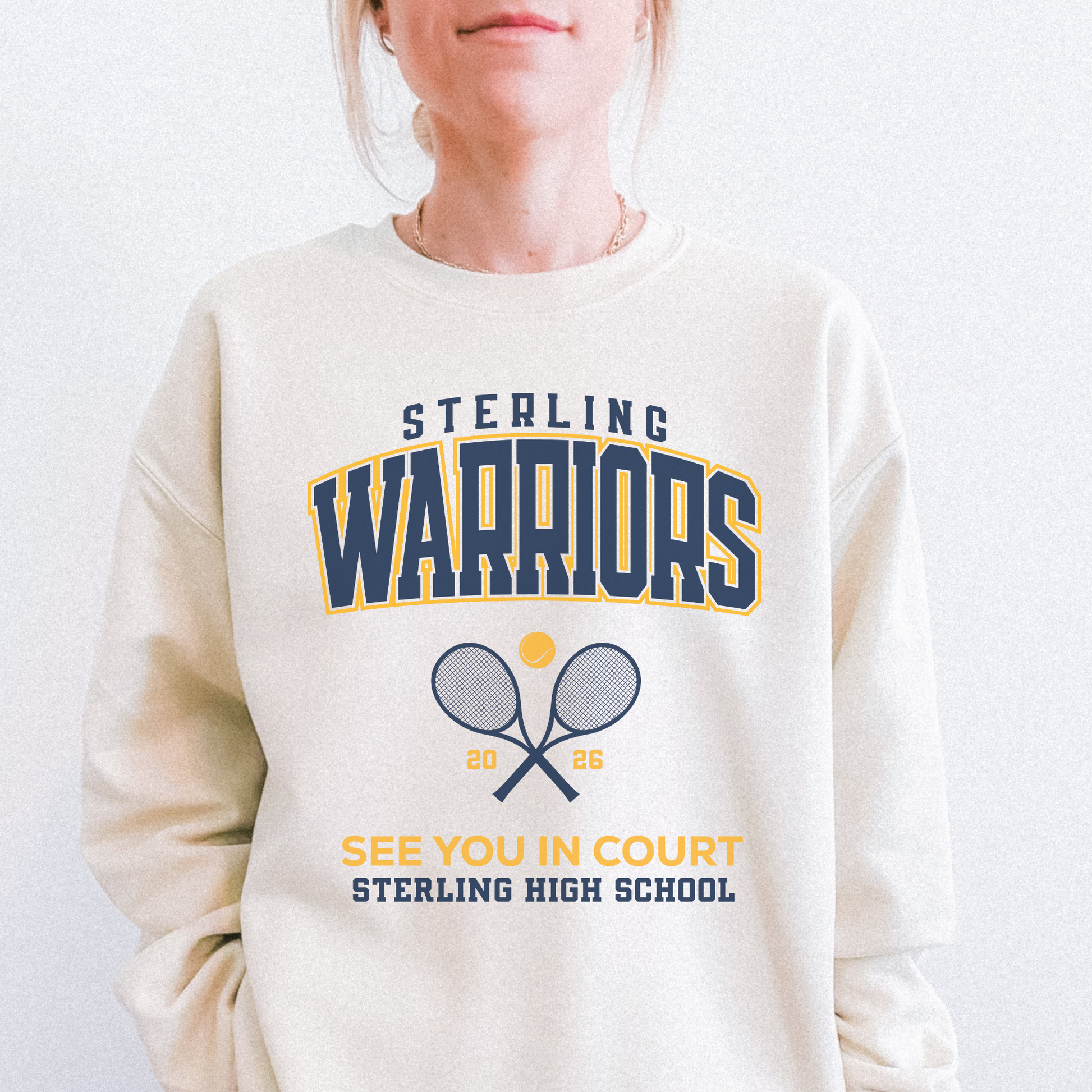Sand colored Sterling Warriors Tennis sweatshirt featuring crossed rackets and SHS lettering