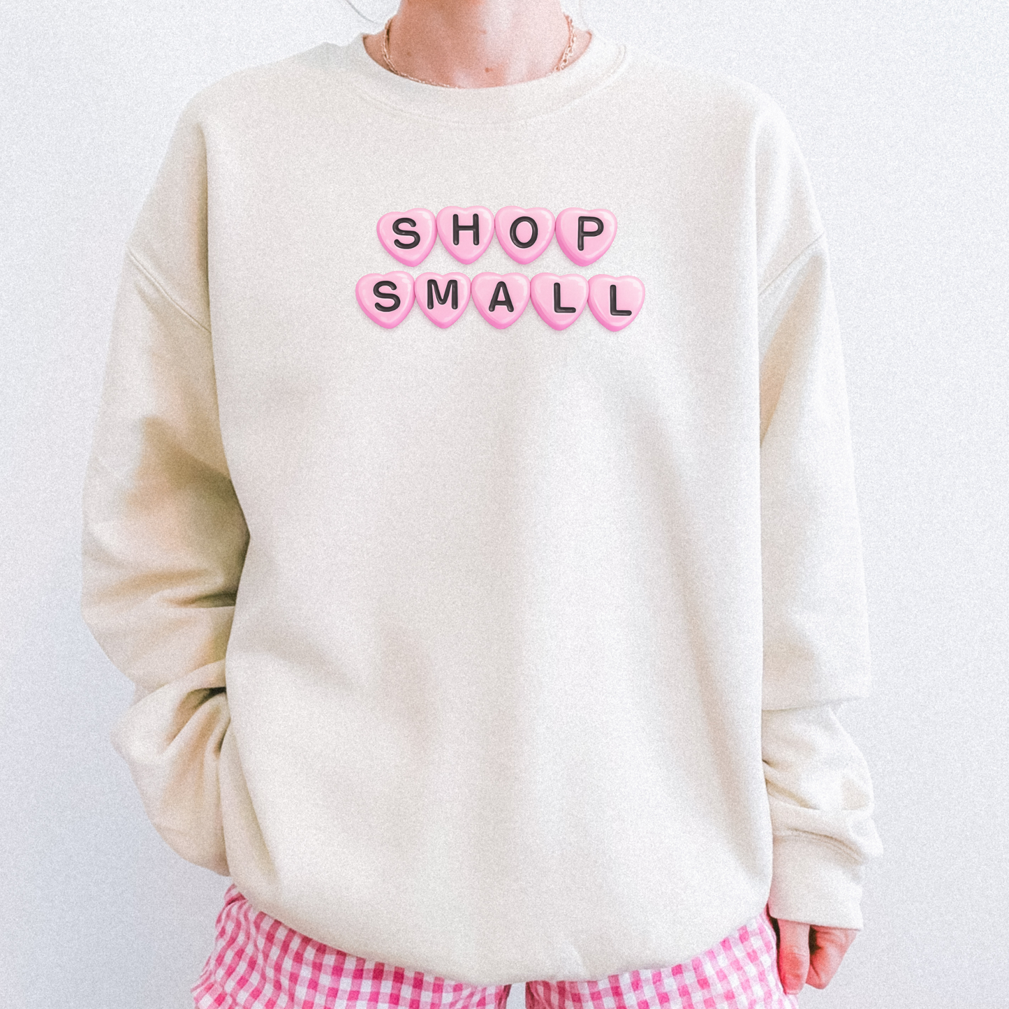 Sand Shop Small crewneck sweatshirt featuring pink heart lettering