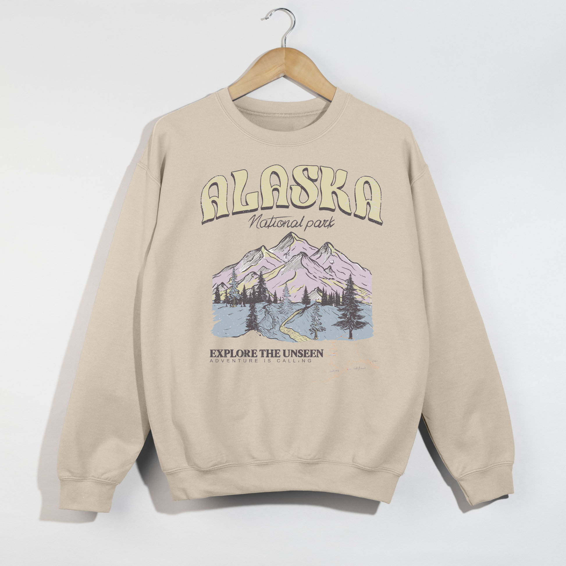 sand colored alaska national park crewneck sweatshirt with vintage mountain design