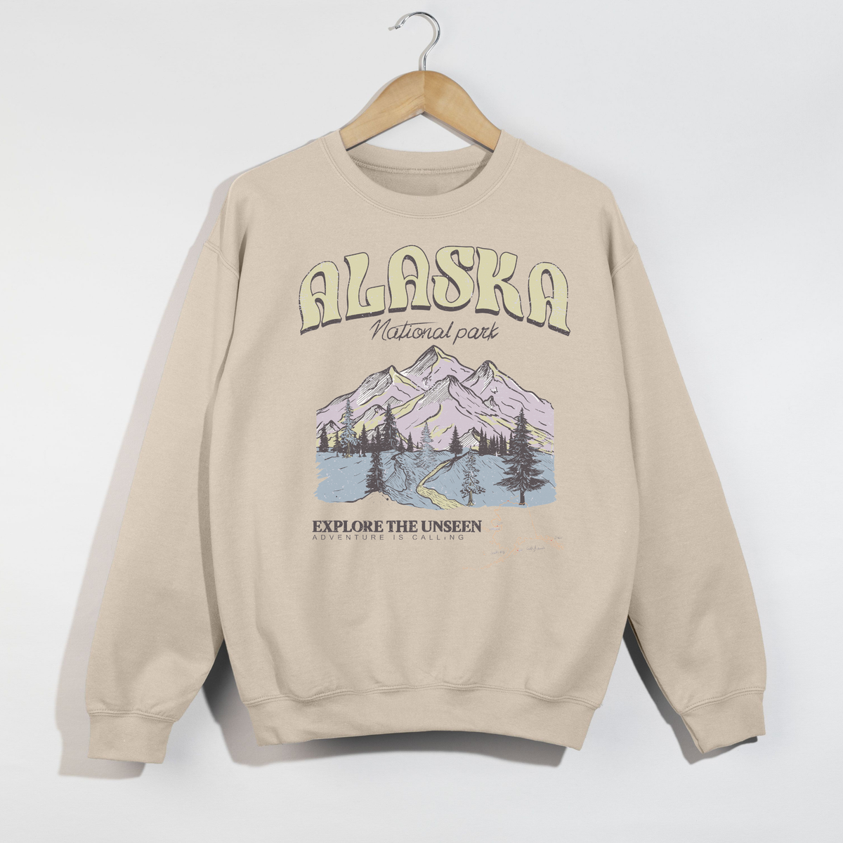 sand colored alaska national park crewneck sweatshirt with vintage mountain design
