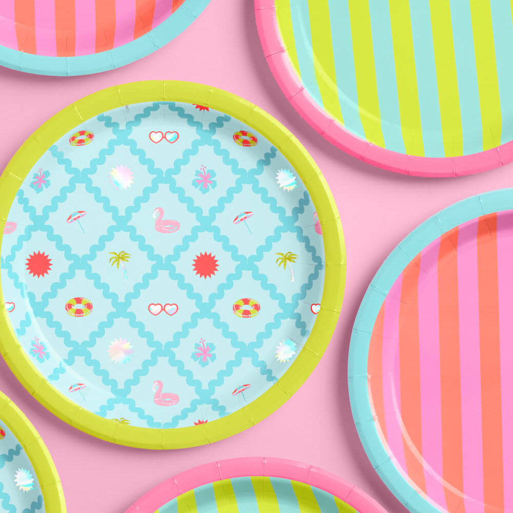 Colorful patterned plates on a pink background