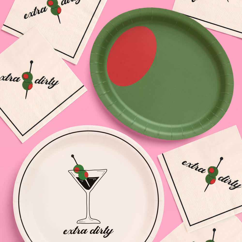 Paper plates with 'extra dirty' design on a pink background