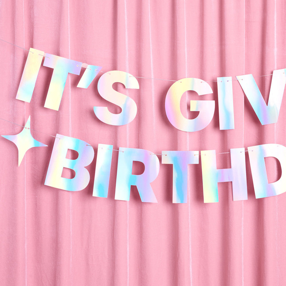 Holographic 'It's Given Birthday' banner on a pink background
