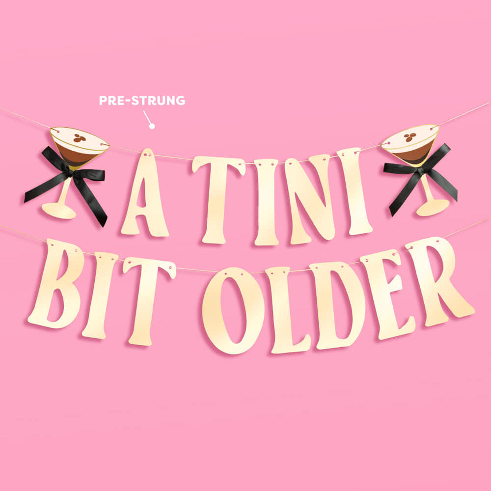 Decorative banner with 'A Tini Bit Older' text on a pink background