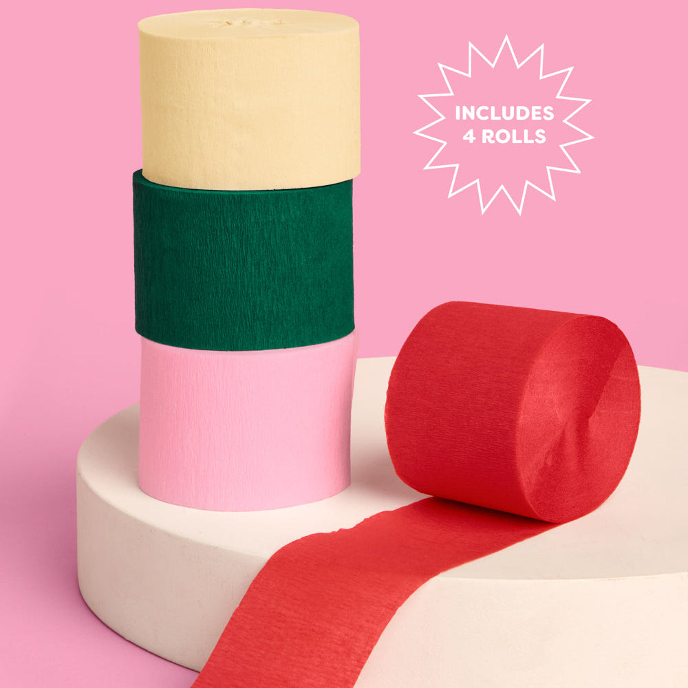 Four rolls of colored paper on a pink background with text indicating 'Includes 4 Rolls'.