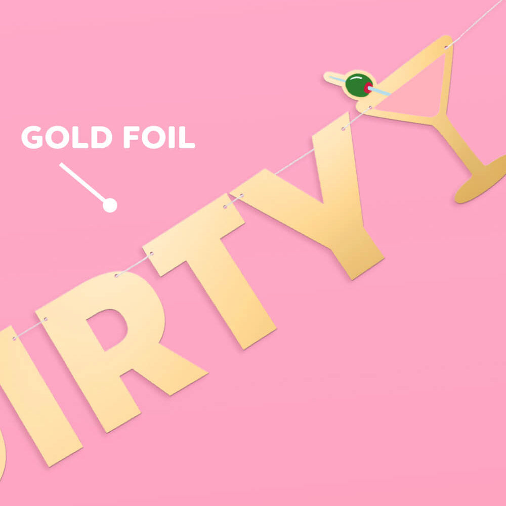 Gold foil 'DIRTY' banner with a cocktail graphic on a pink background